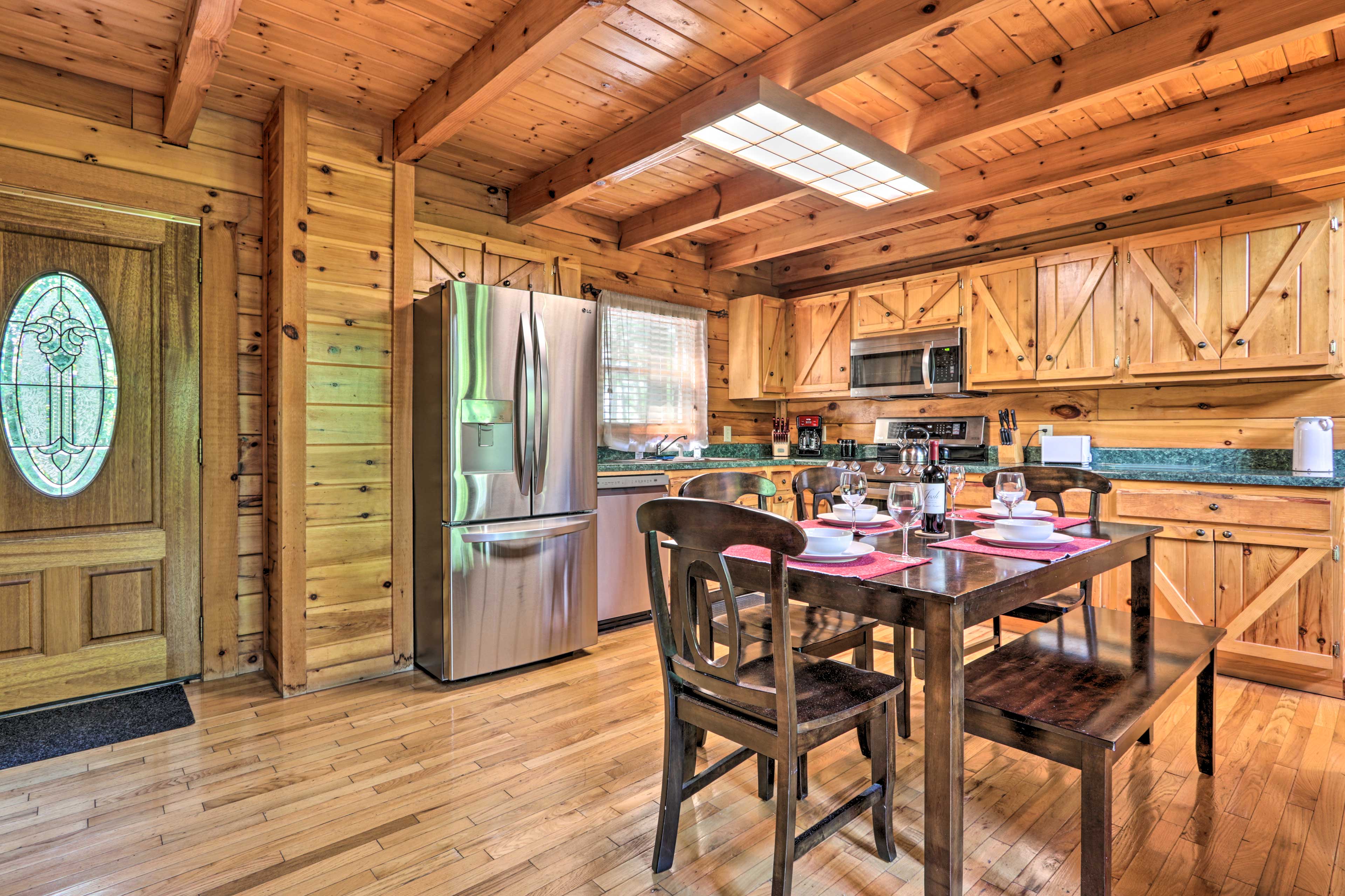 The kitchen is fully equipped with stainless steel appliances.