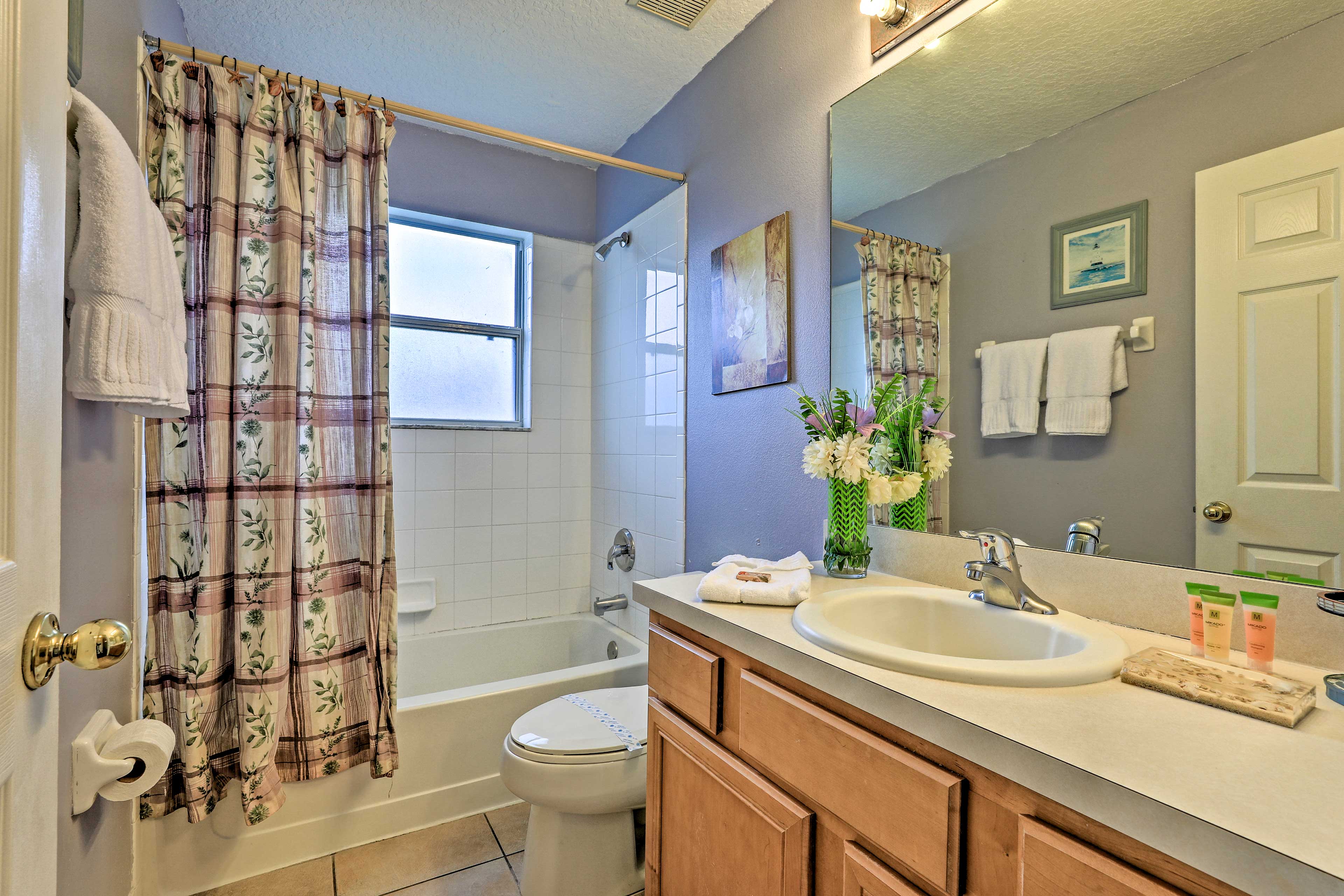 A shower/tub combo outfits this full bathroom.