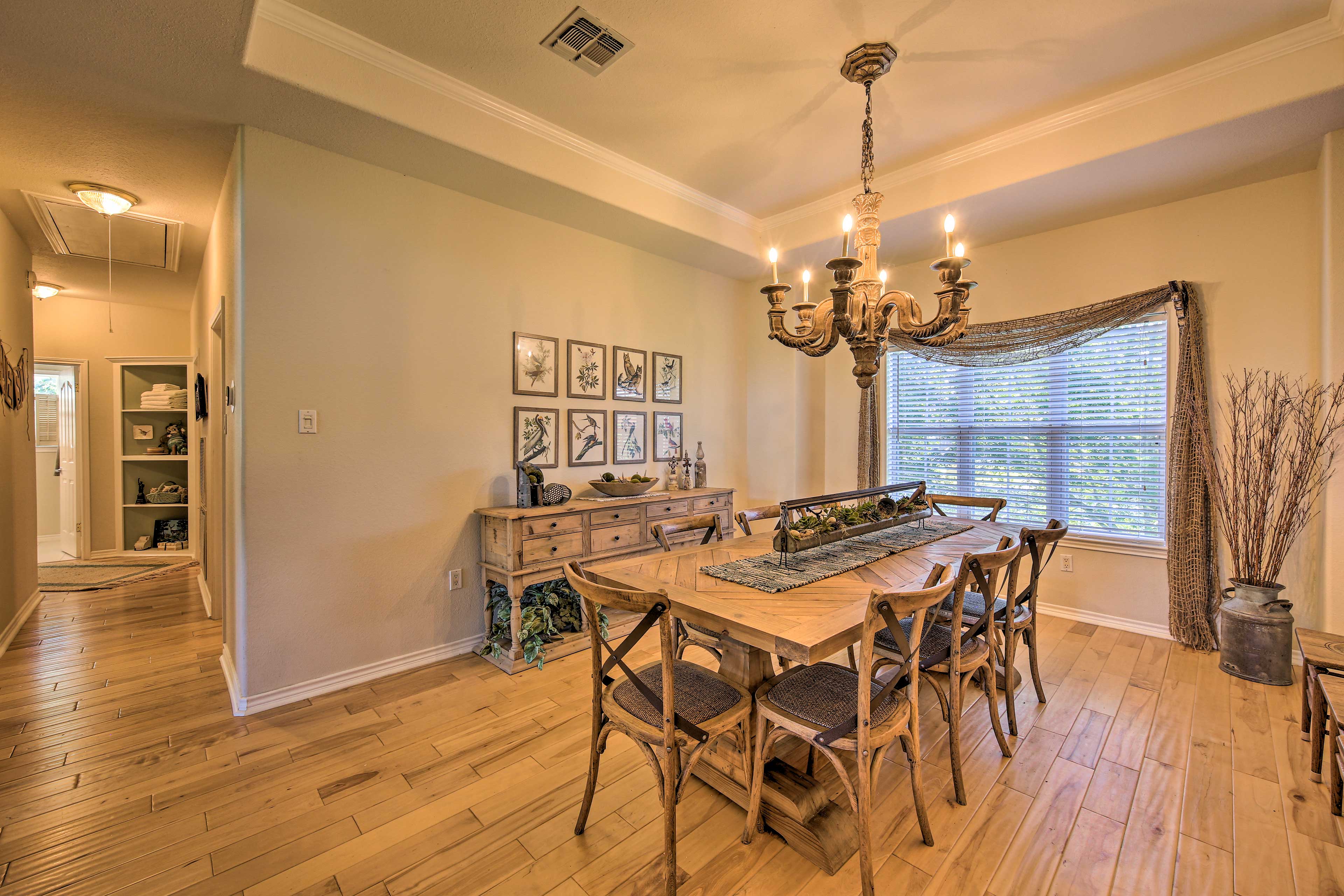 The formal dining room offers additional seating, with an extended dining table.