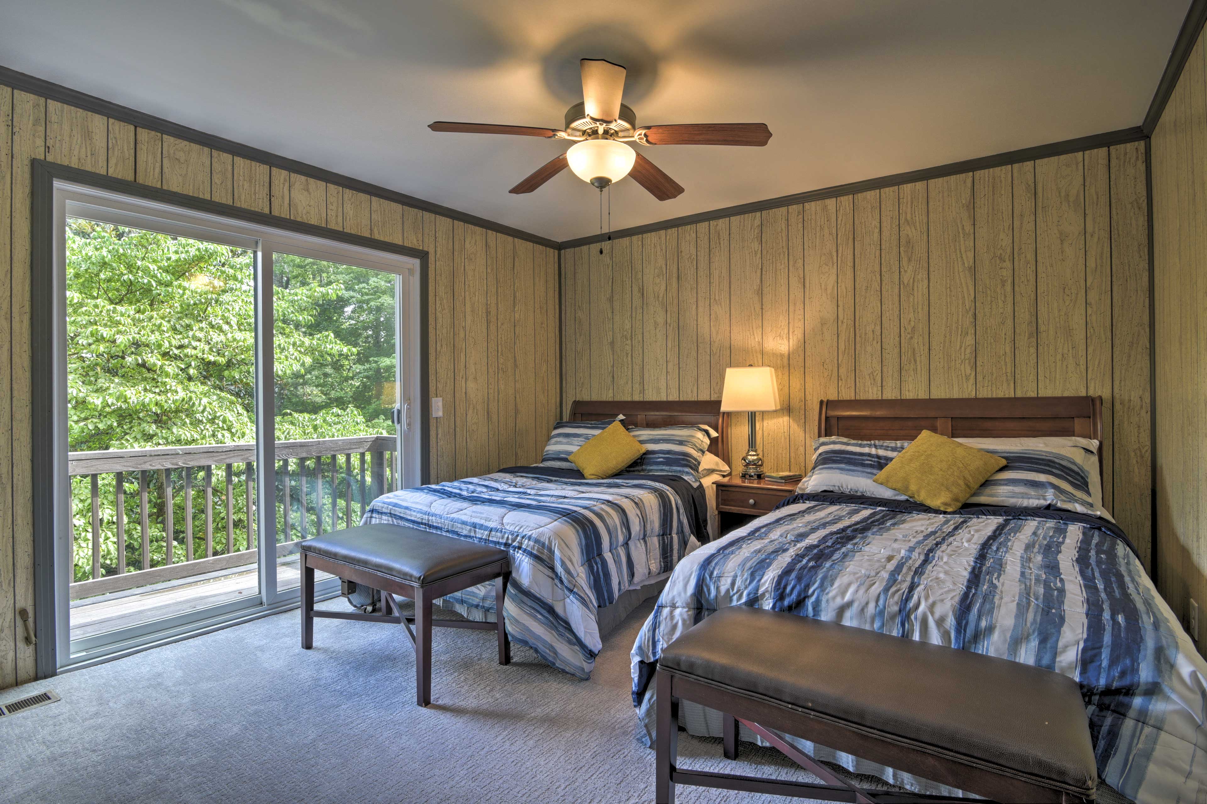 Two full beds provide sleeping accommodations for 4 guests in this bedroom.