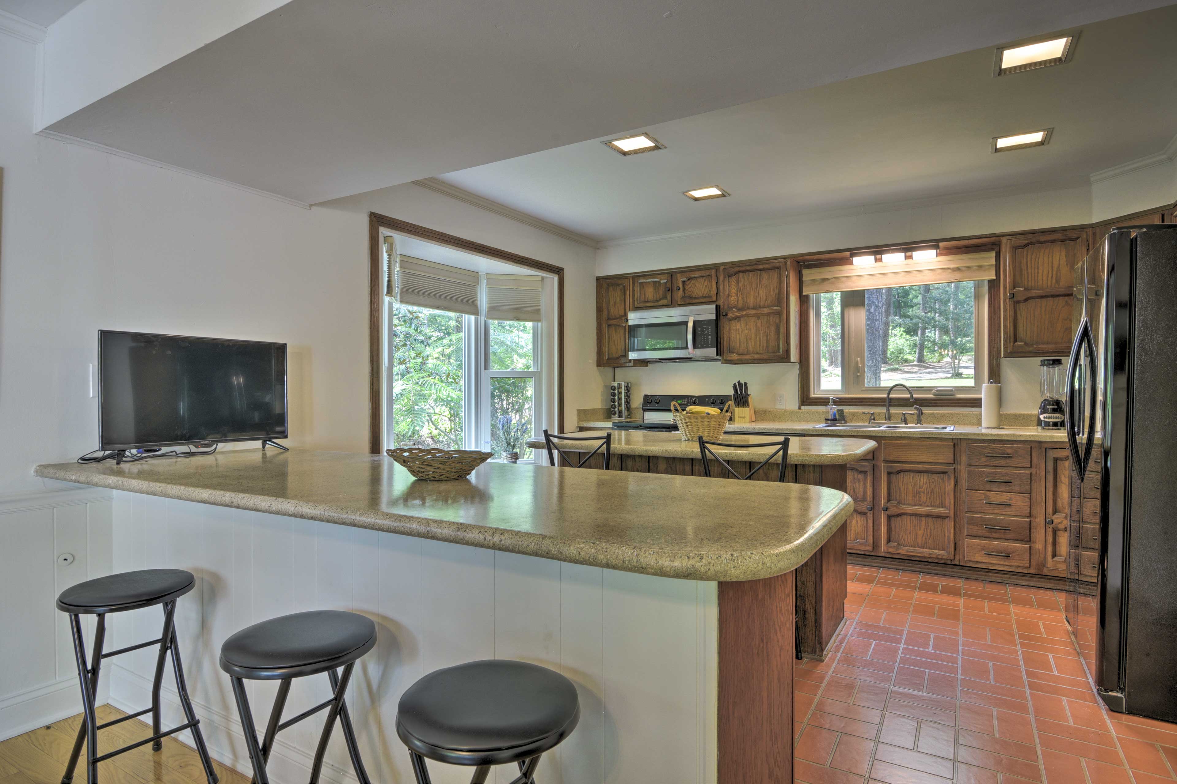 Claim a seat at the breakfast bar to watch some TV.