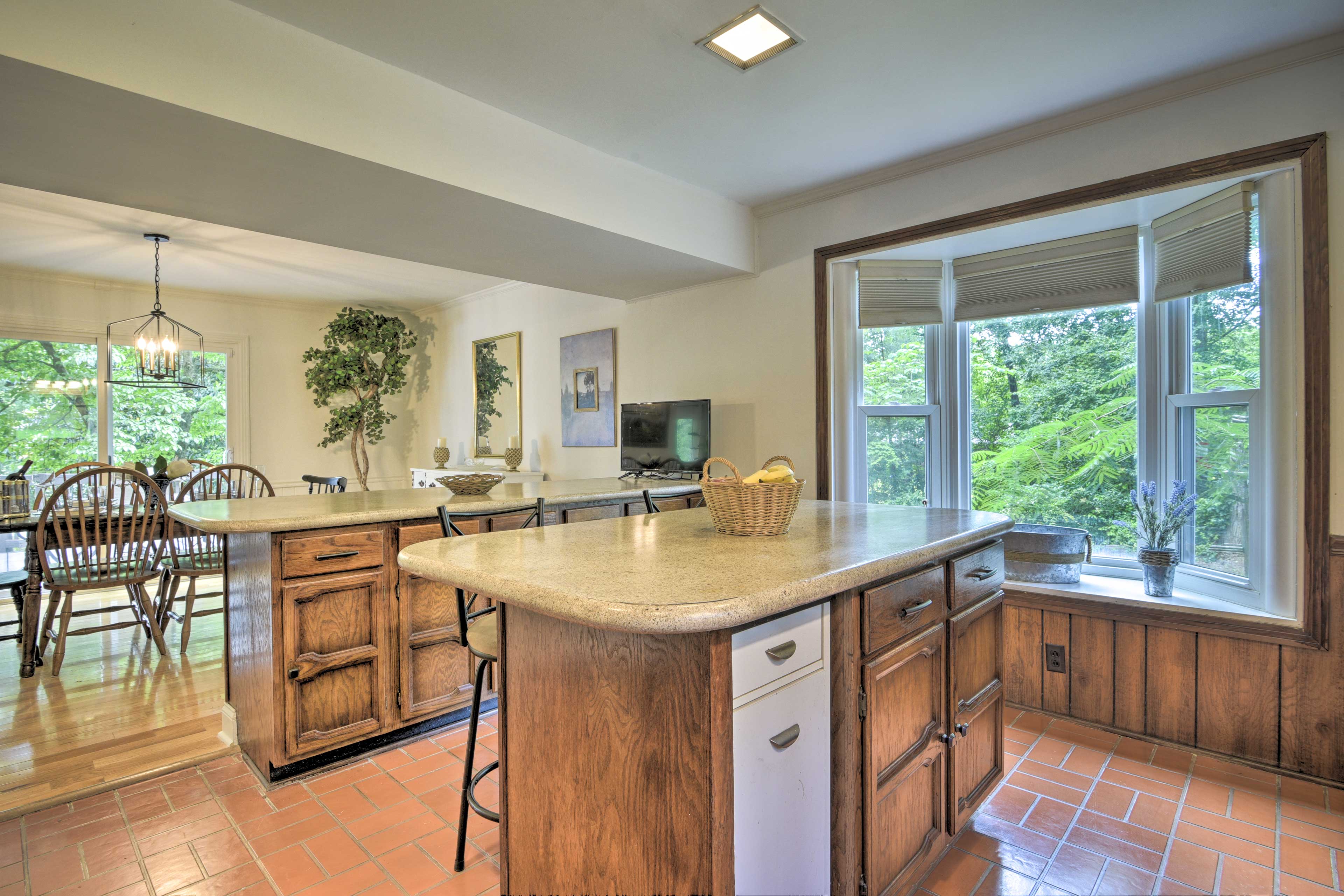 The bay window allows plenty of sunlight to stream in.