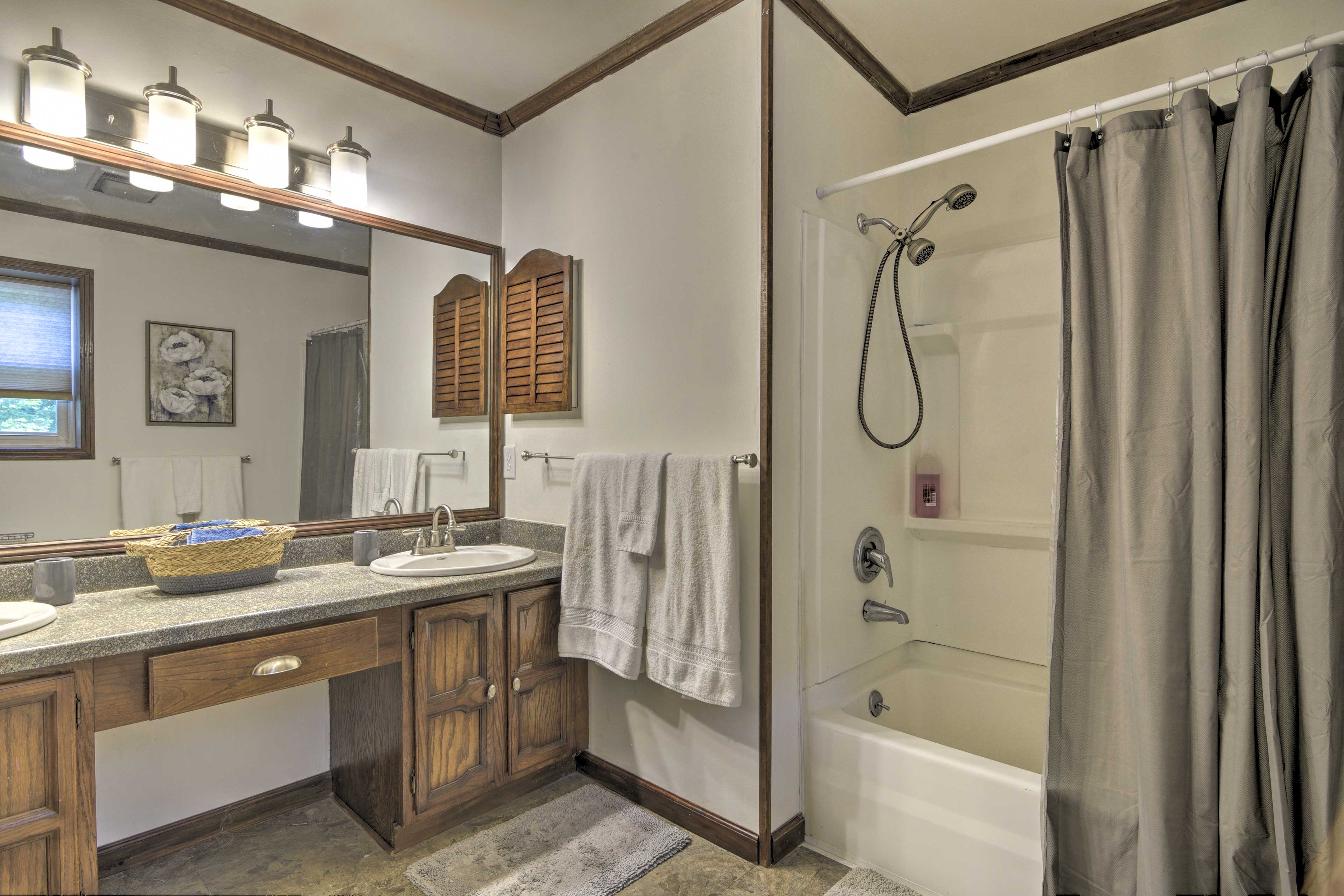 Double sinks and a shower/tub combo complete this full bathroom.