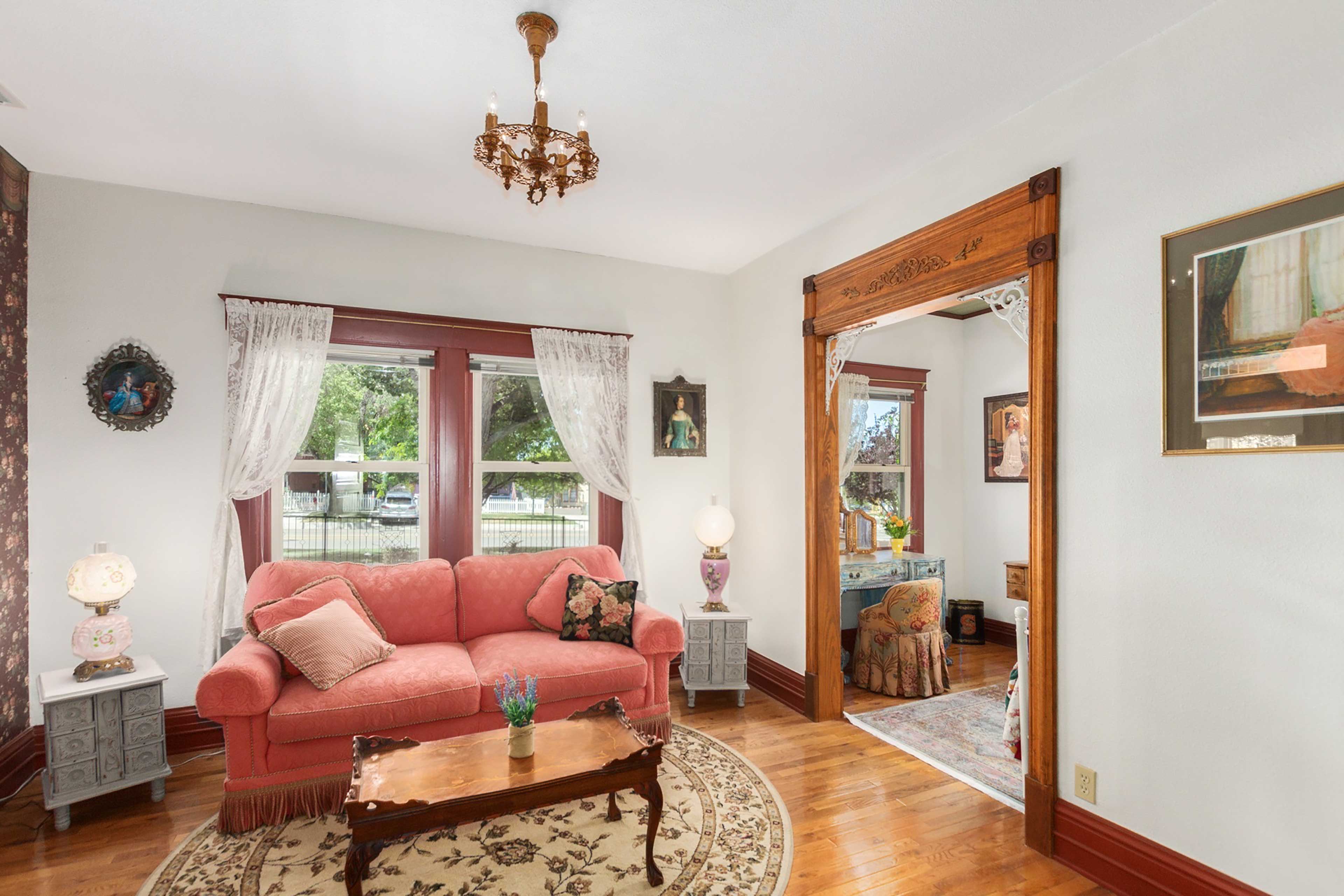 This charming sitting room features a sleeping space as well.