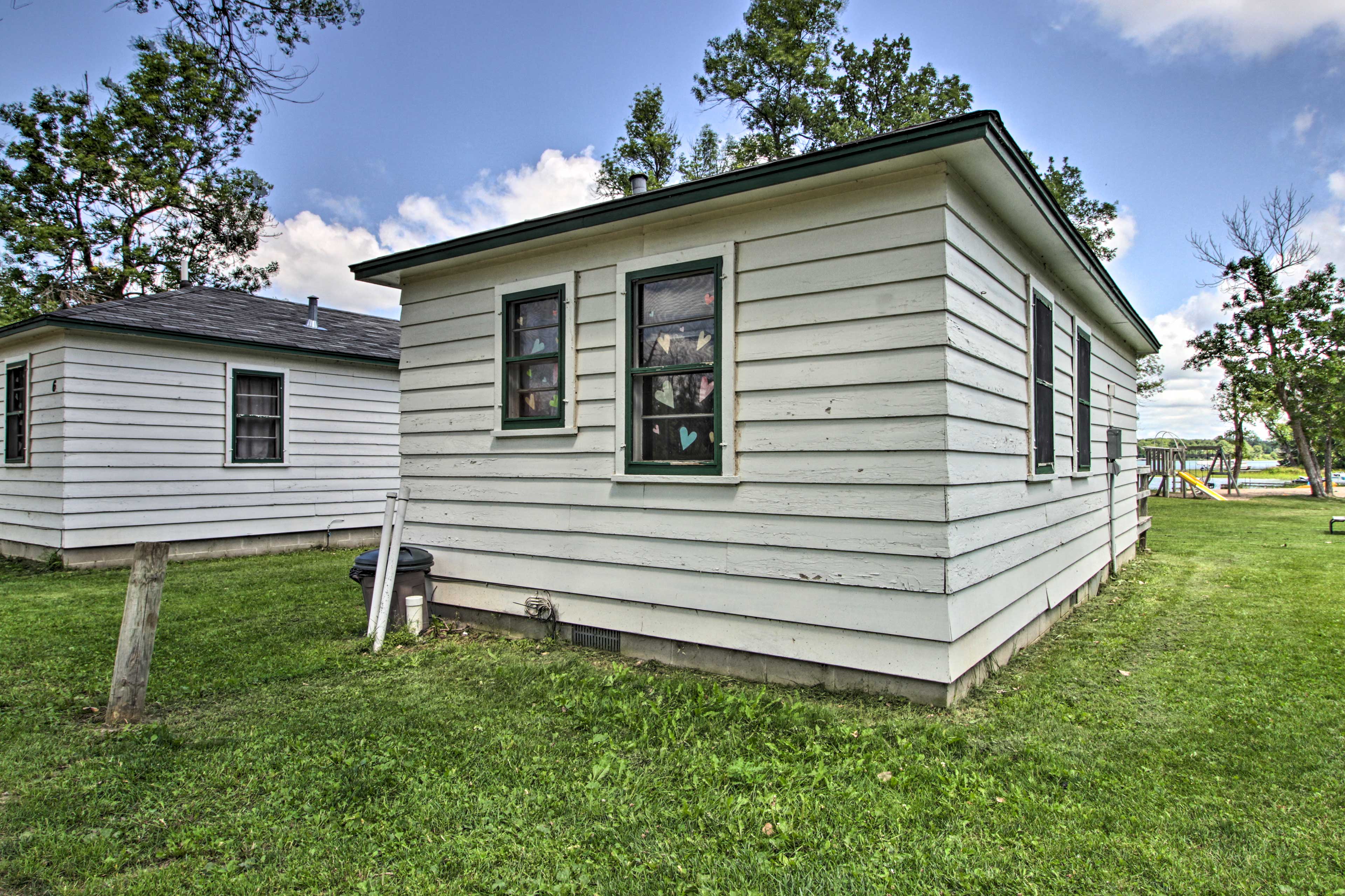 This home has plenty of yard space and a charcoal grill.