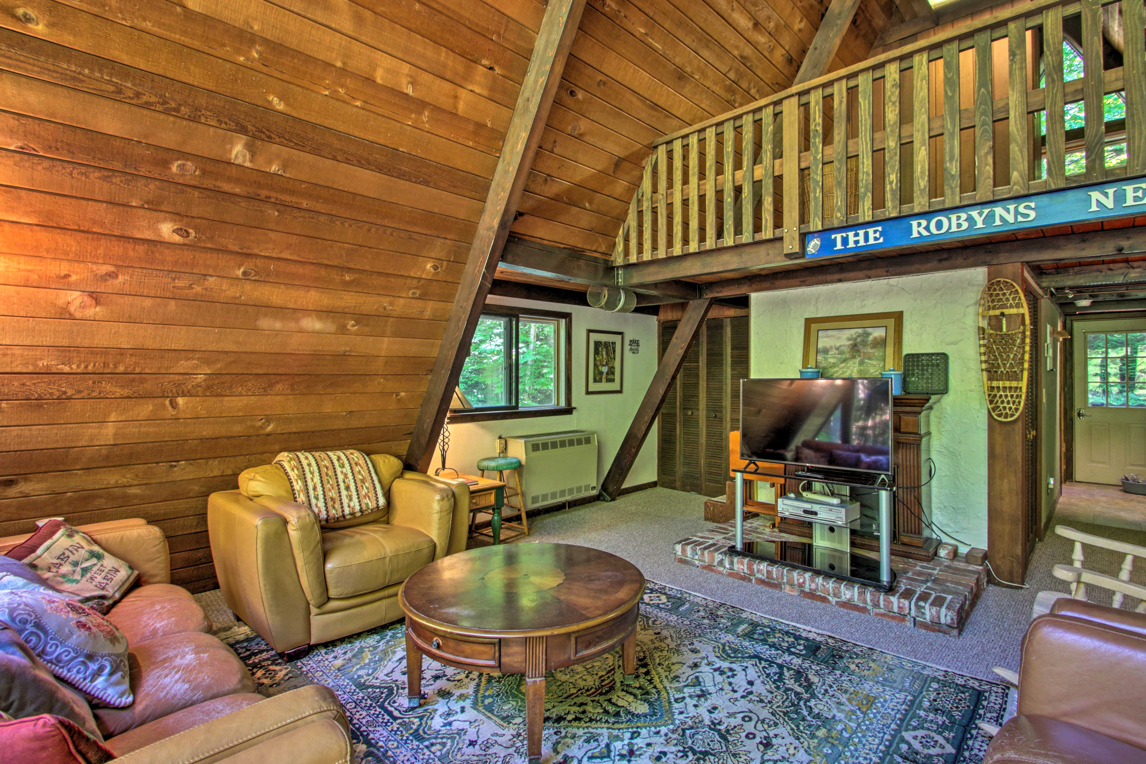 Exposed beams and high ceilings offer a warm, inviting interior.