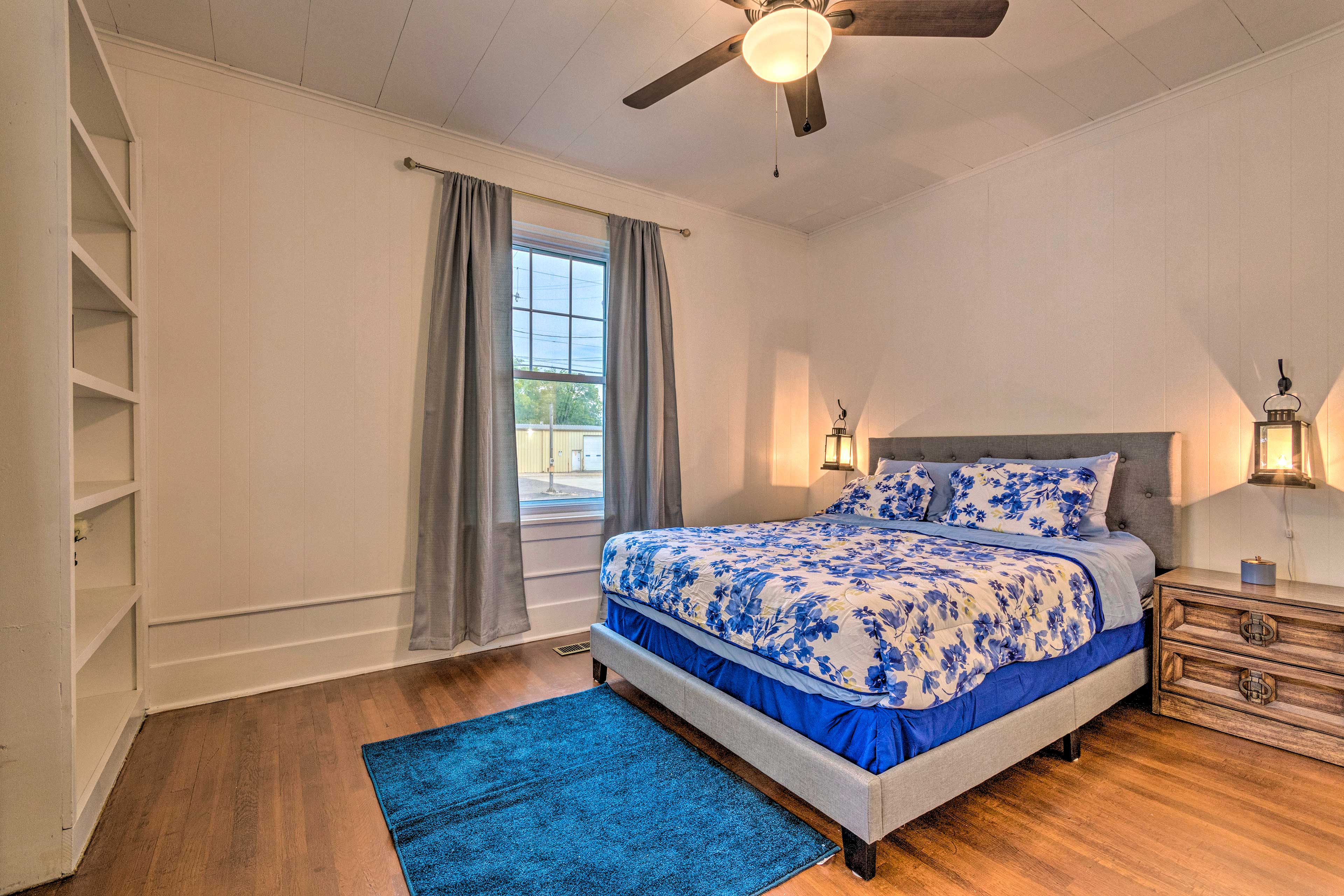 This bedroom boasts a California king bed.