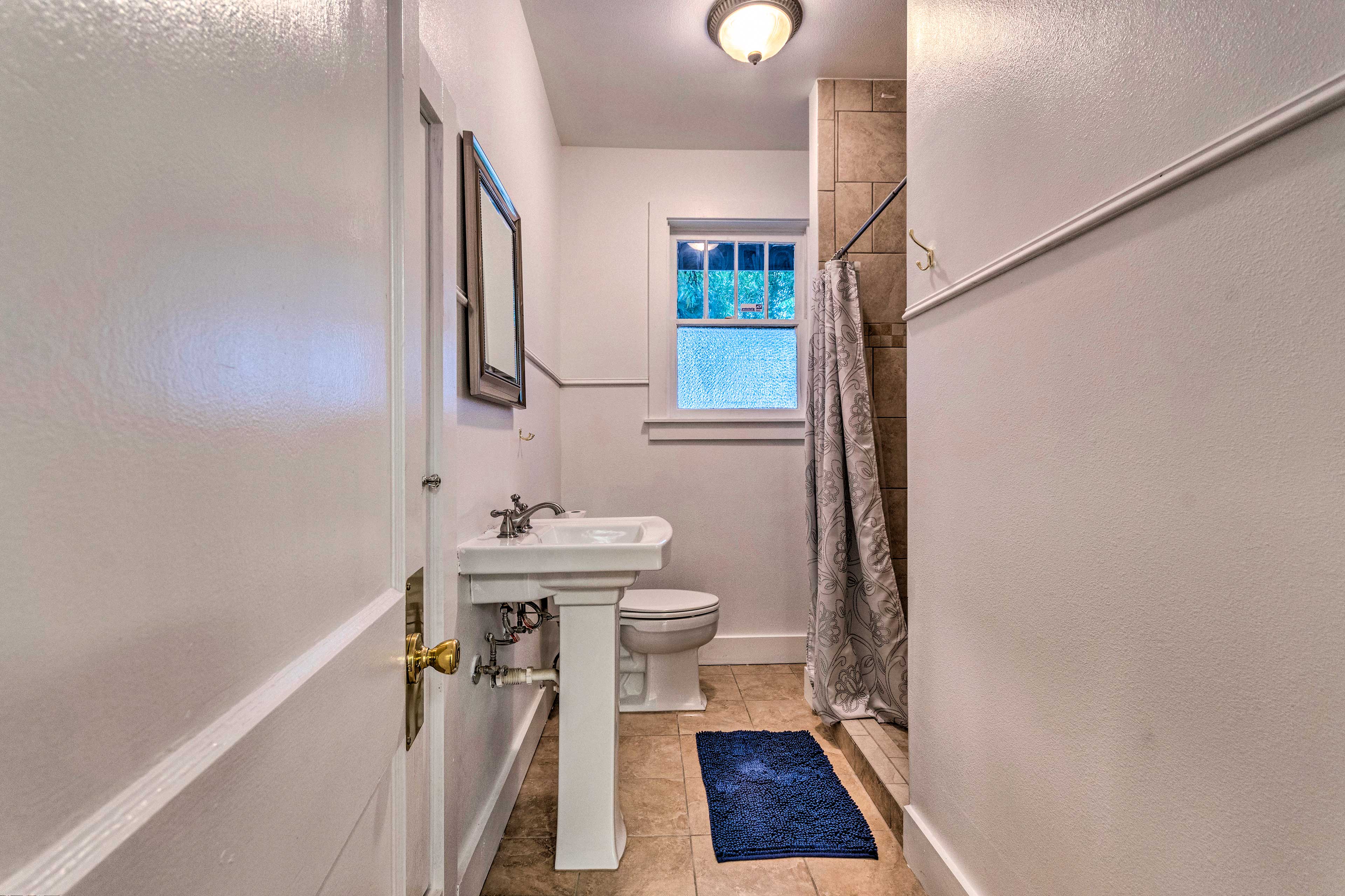 A second full bathroom has a walk-in shower.