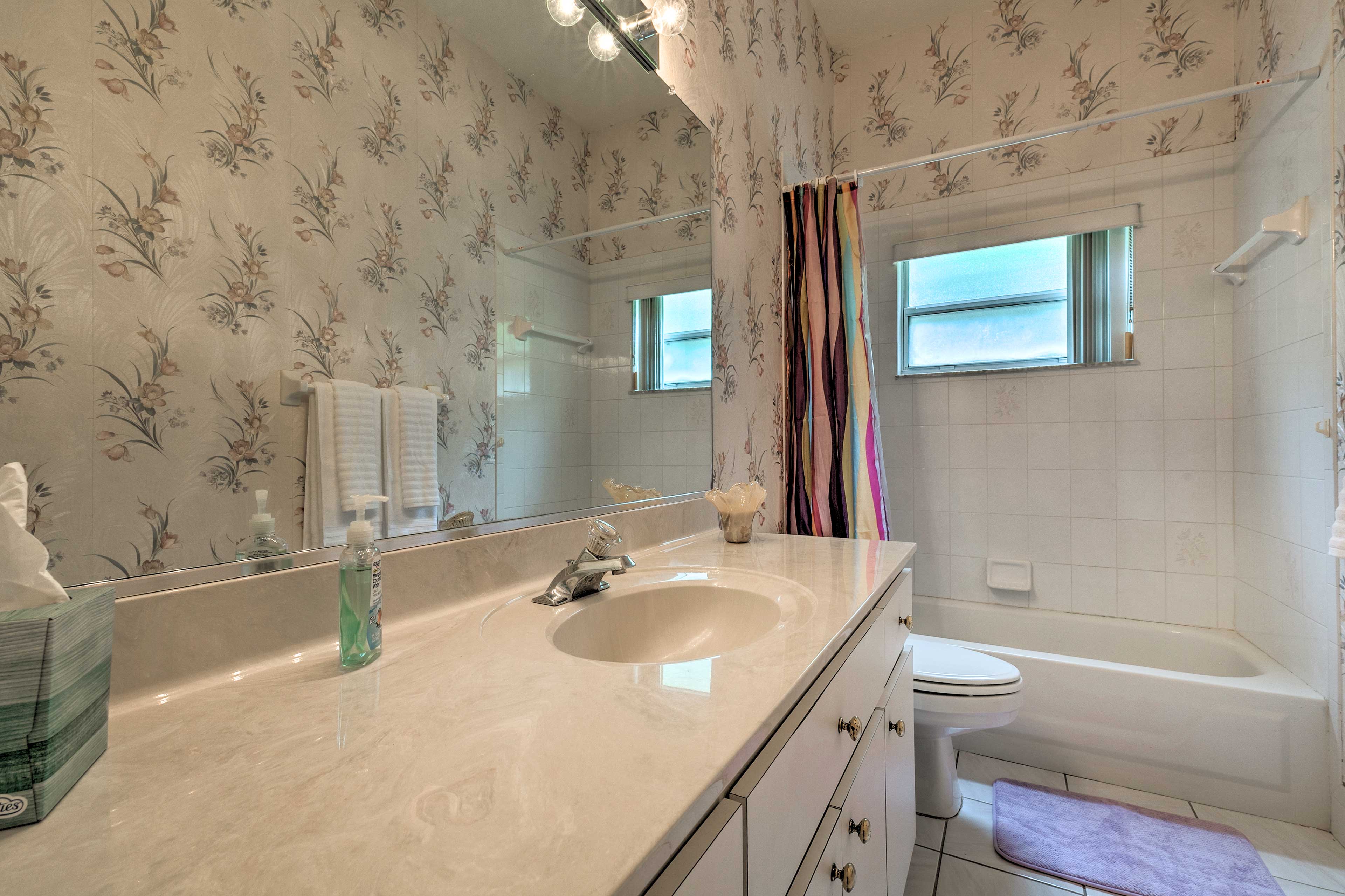 The second bathroom features a shower/tub combo.