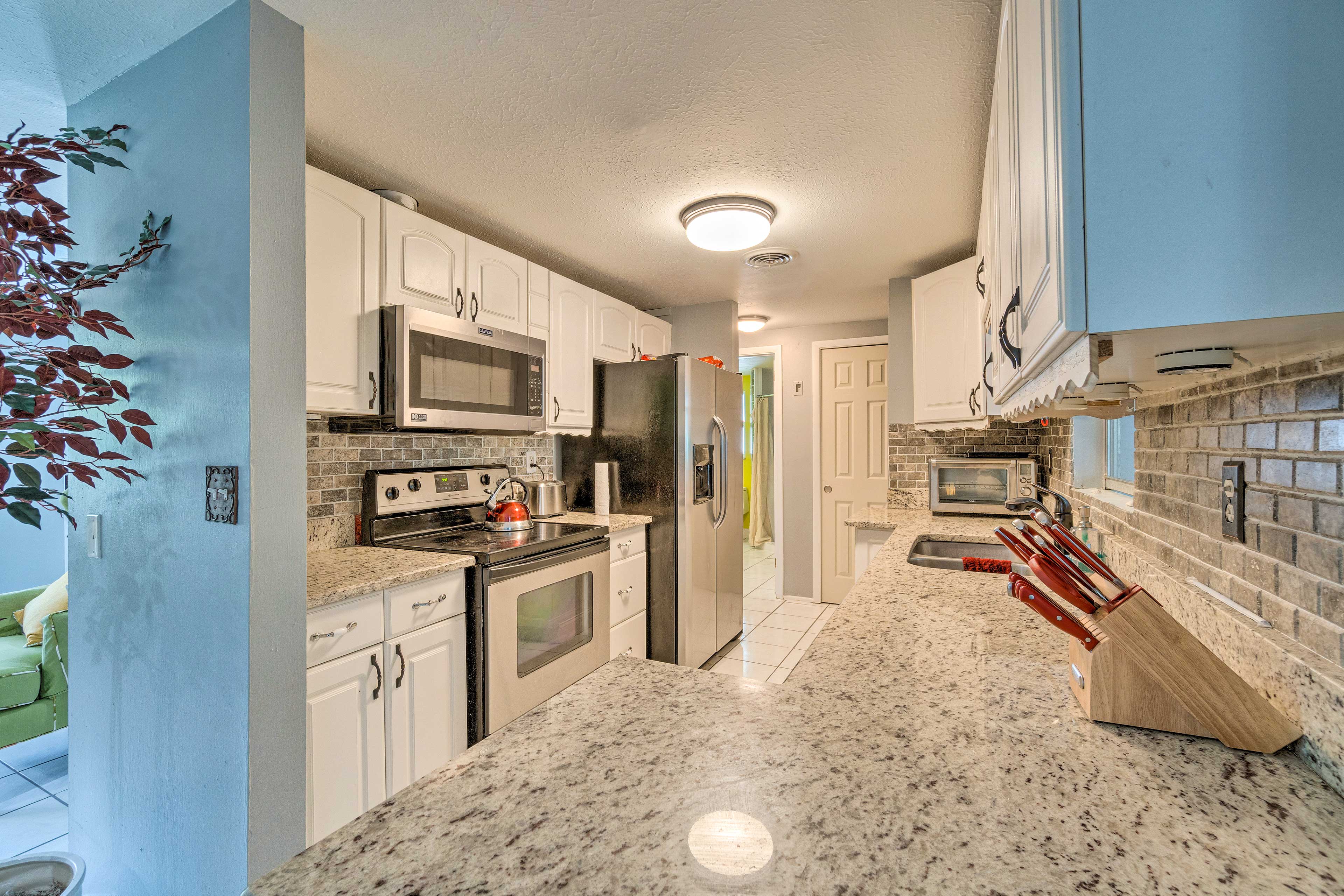 The kitchen is complete with stainless steel appliances.