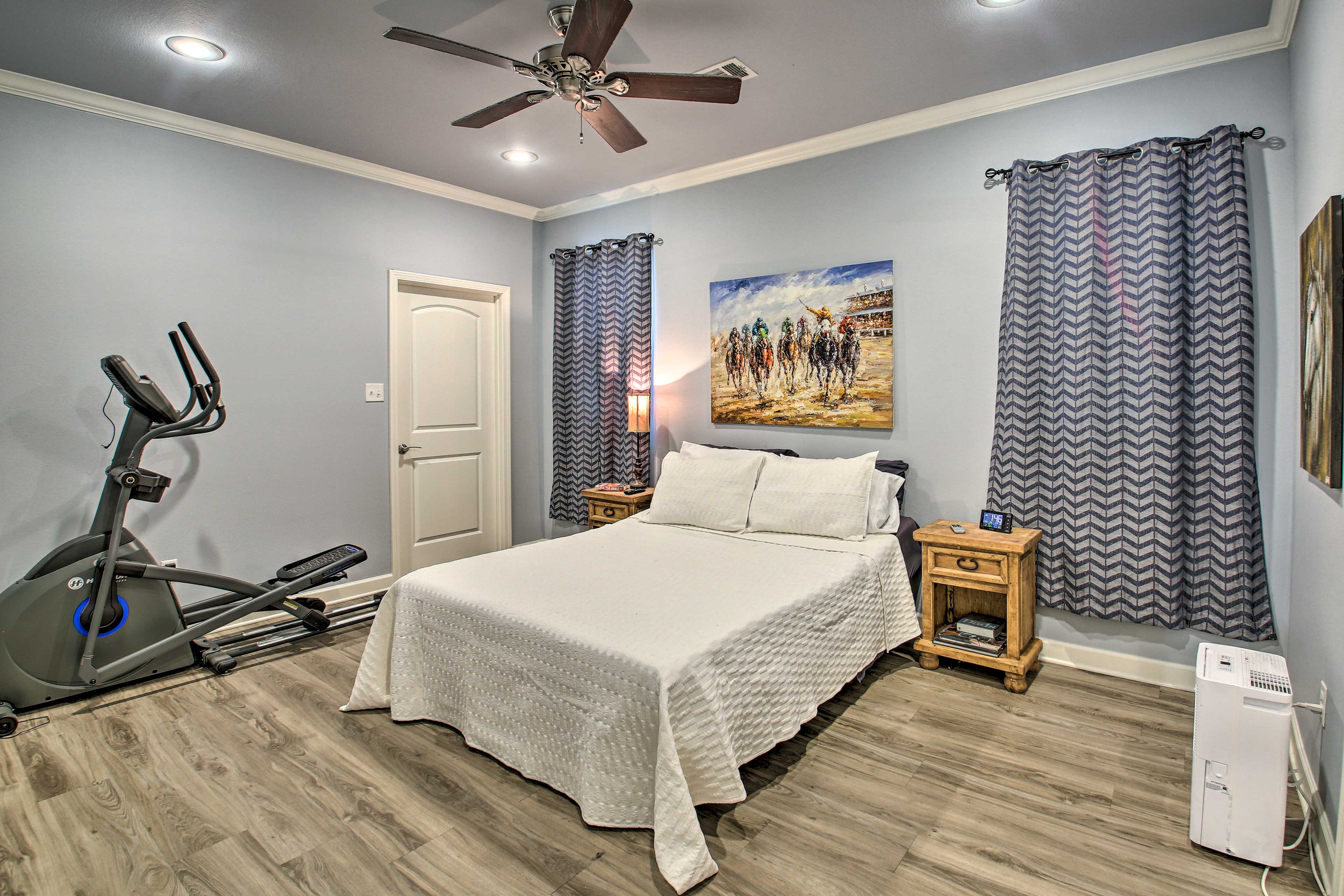 The master bedroom features a queen-sized bed.