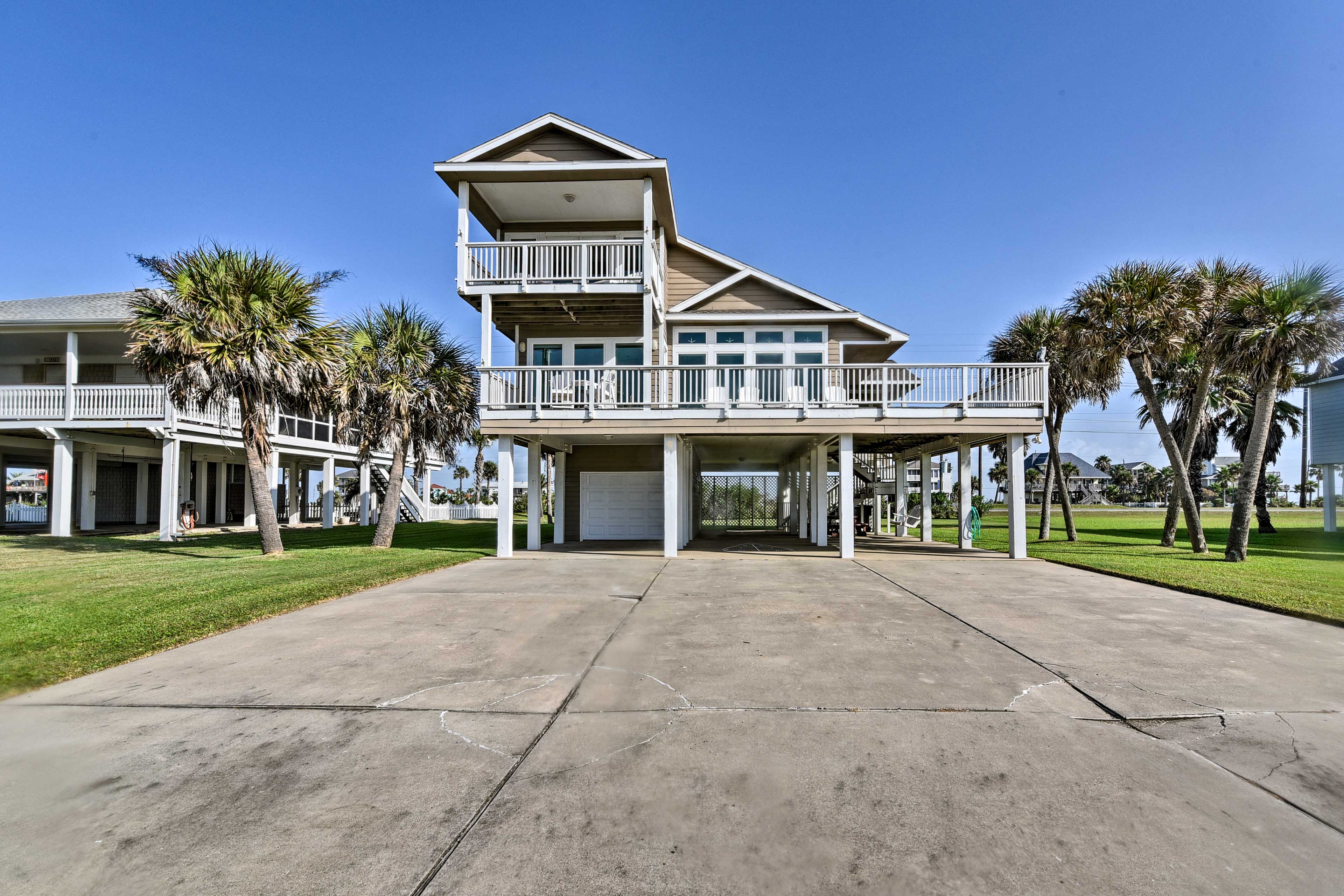 The beach lies just a short walk away from this grand home.