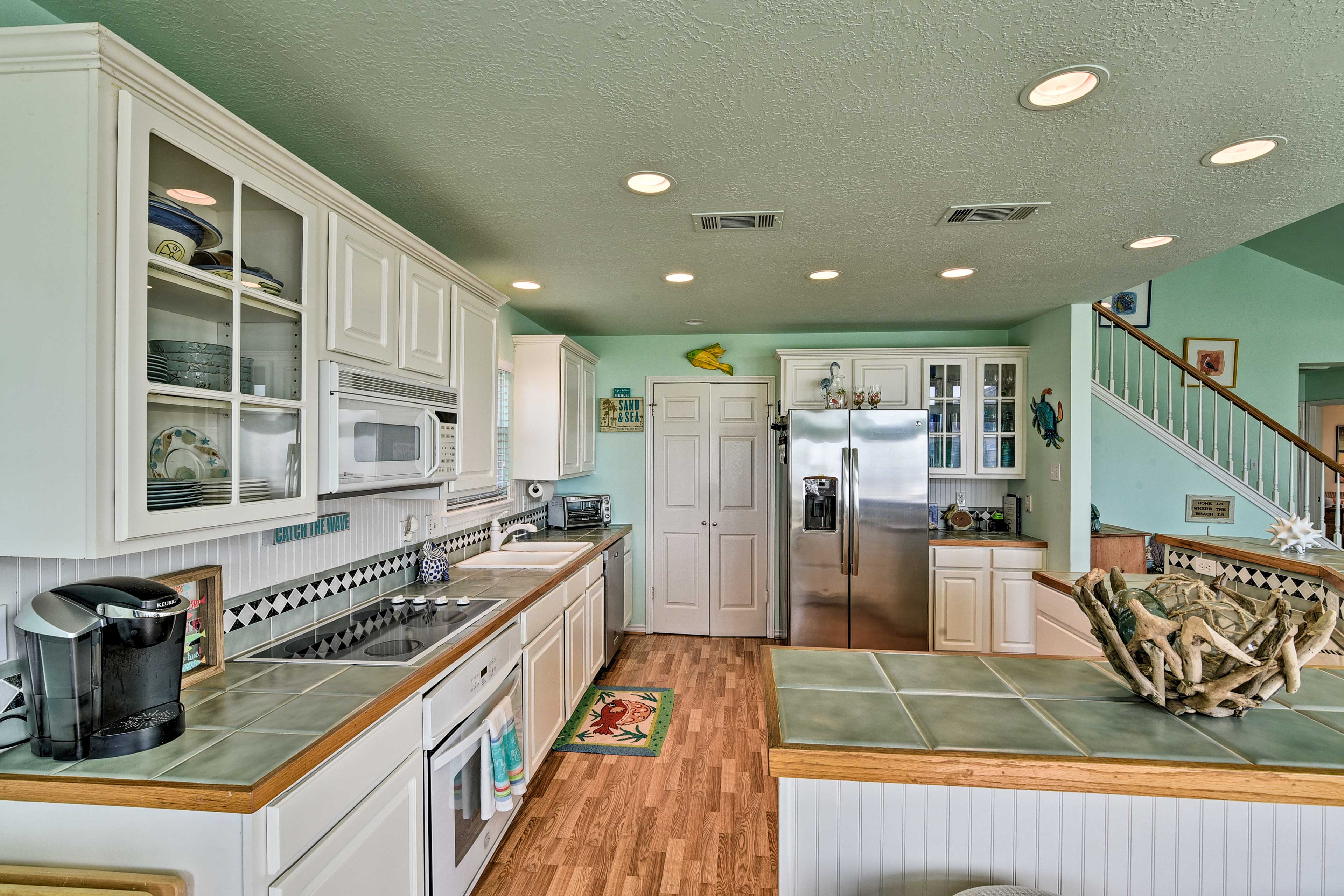 This kitchen features all of the bells and whistles, including a Keurig!