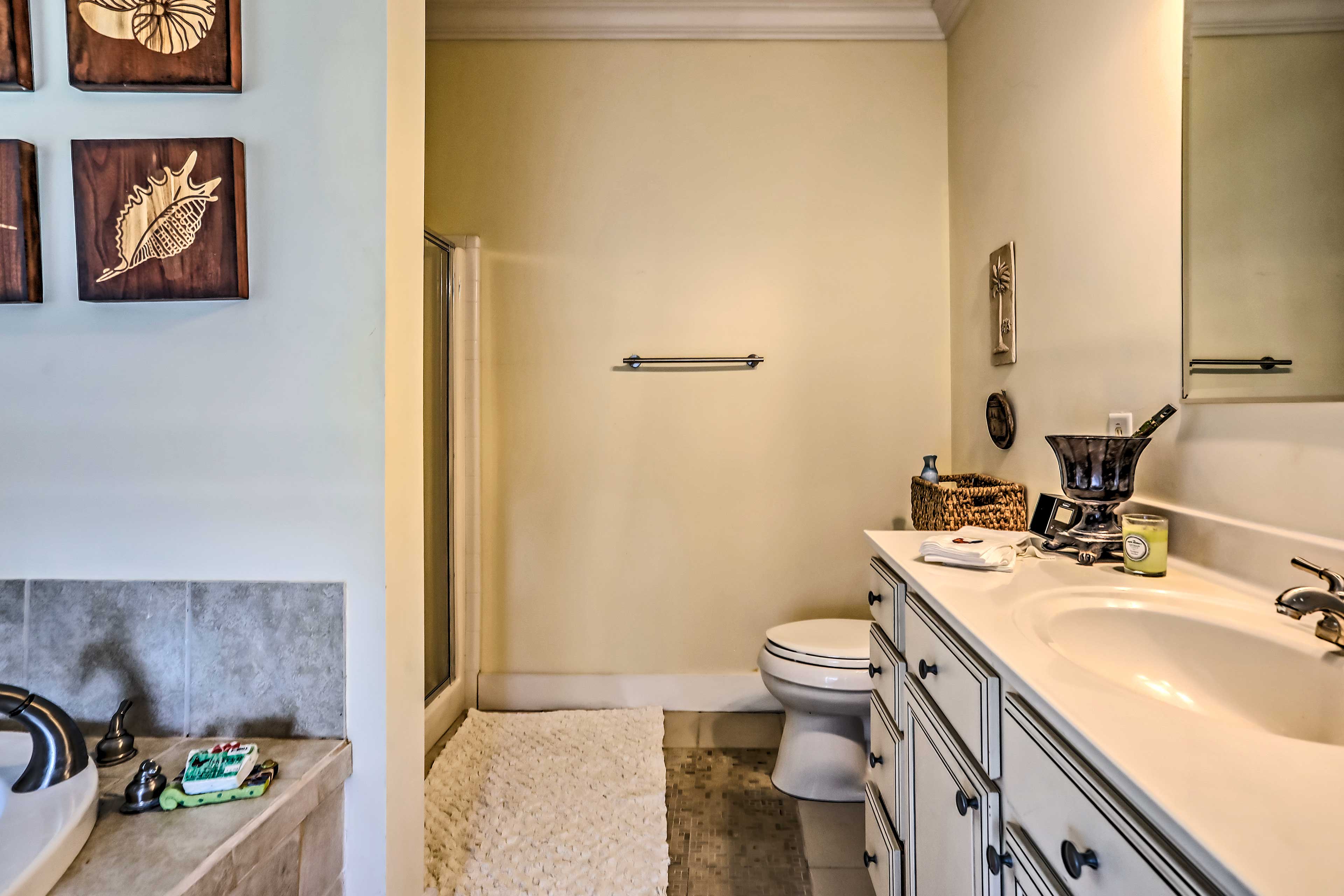 This grand full bathroom features a separate shower and bathtub.