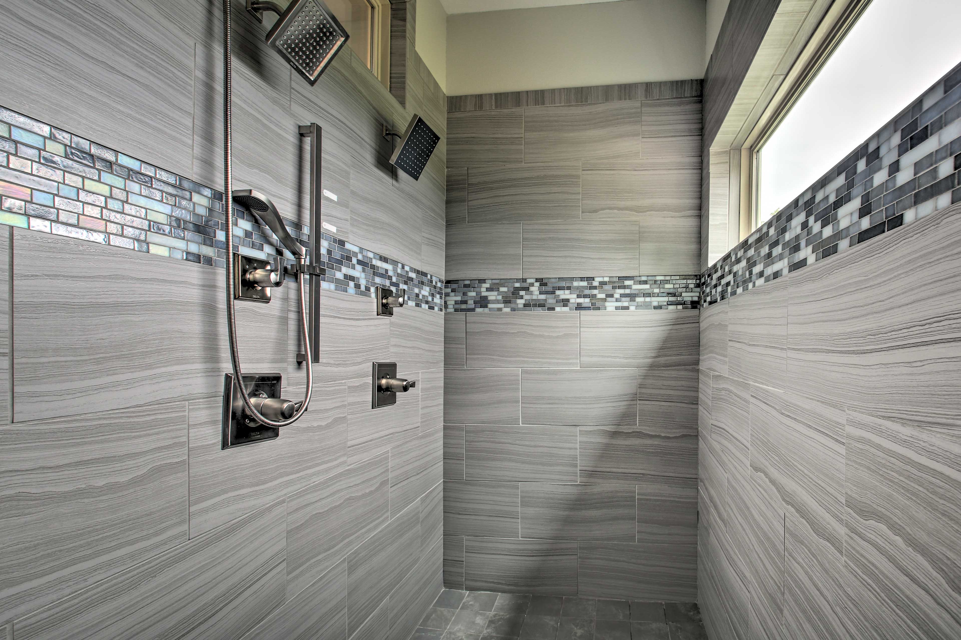 Dual shower heads complete this luxury bathroom.