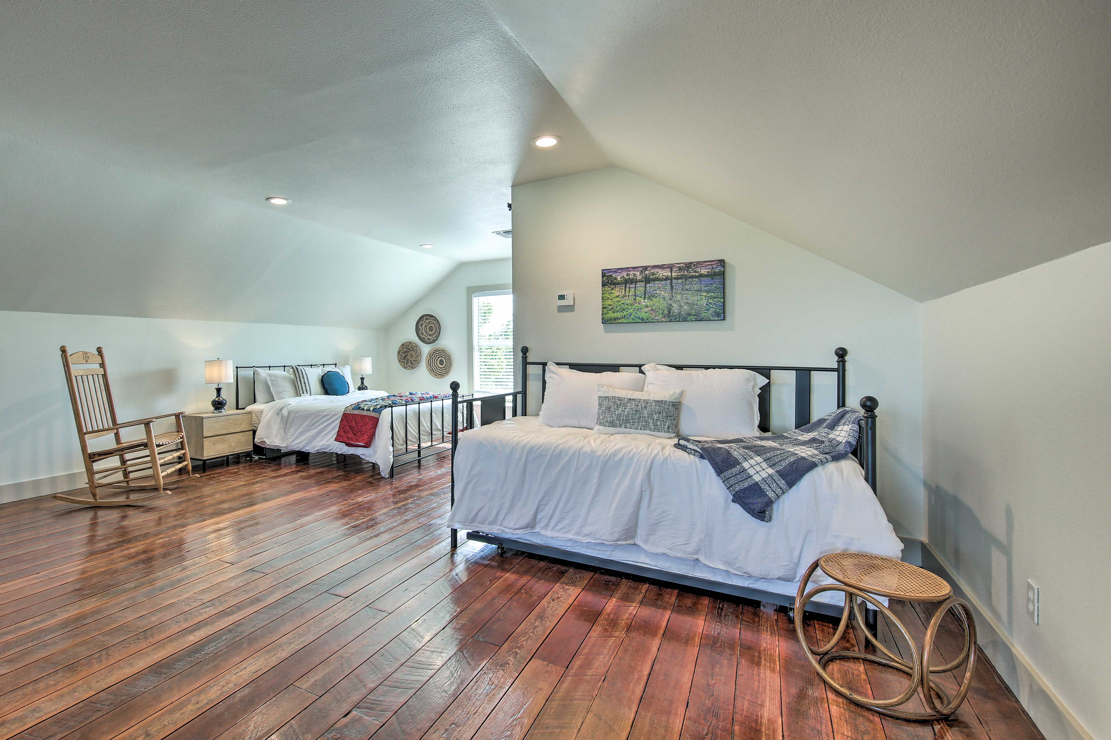 The upstairs bedroom has a queen bed and twin daybed with a twin trundle bed.