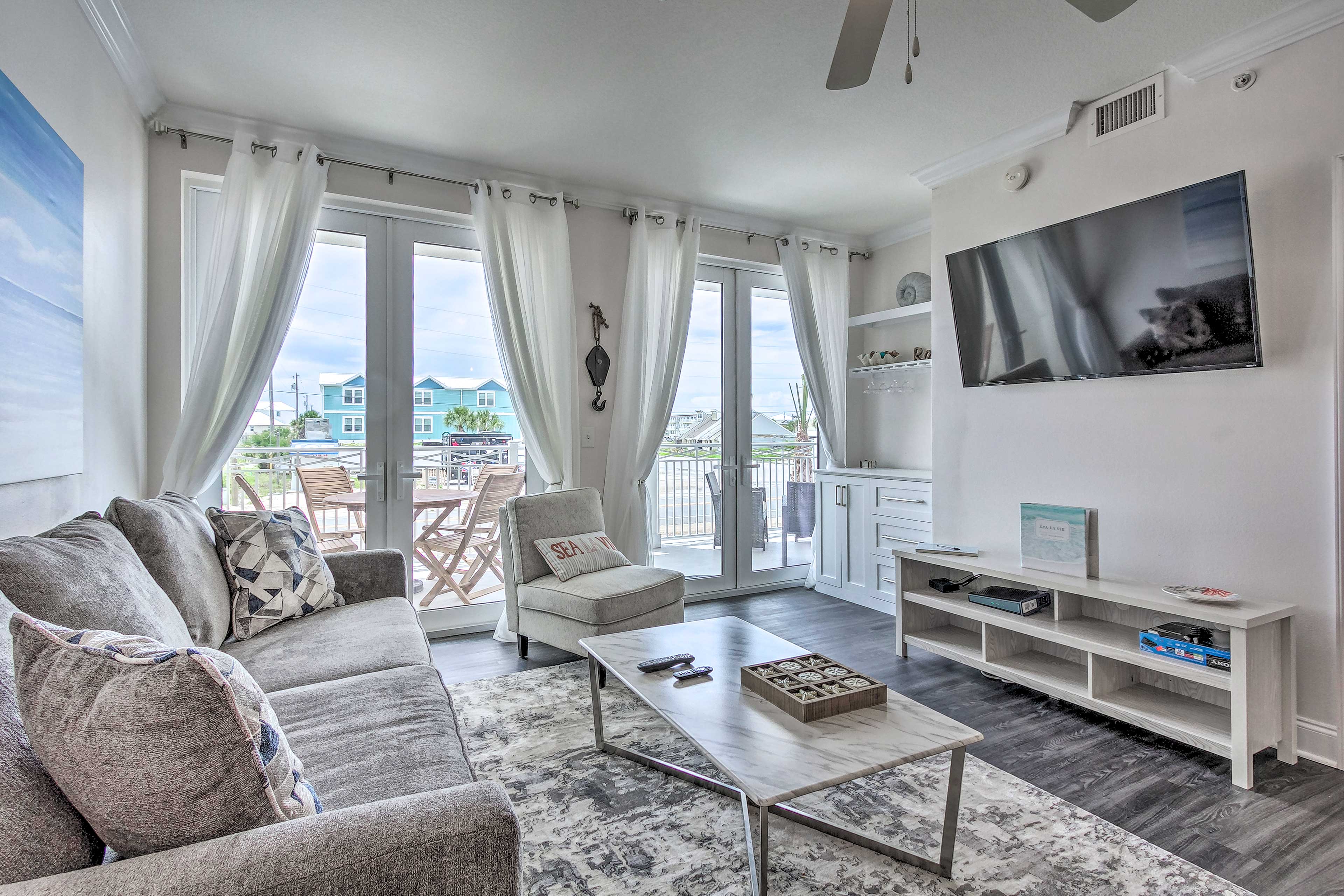 The sunny living area features a Smart TV and balcony acess.