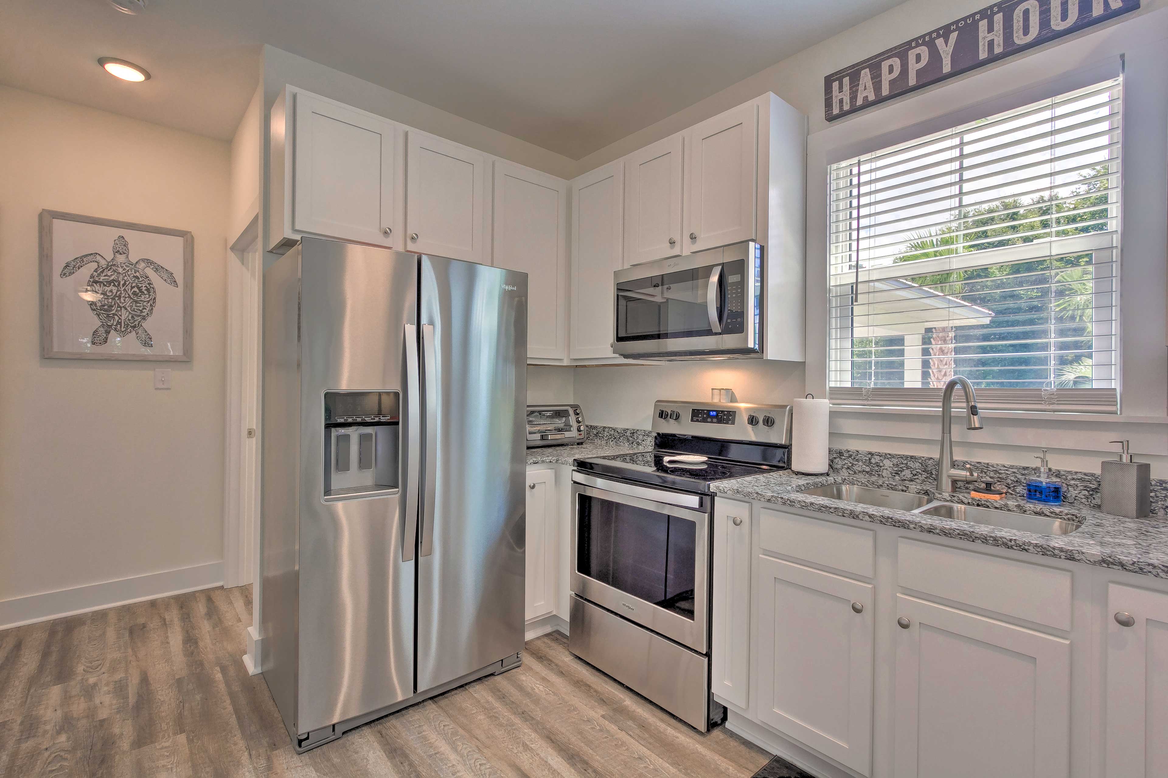 The kitchen is fully equipped with stainless steel appliances.