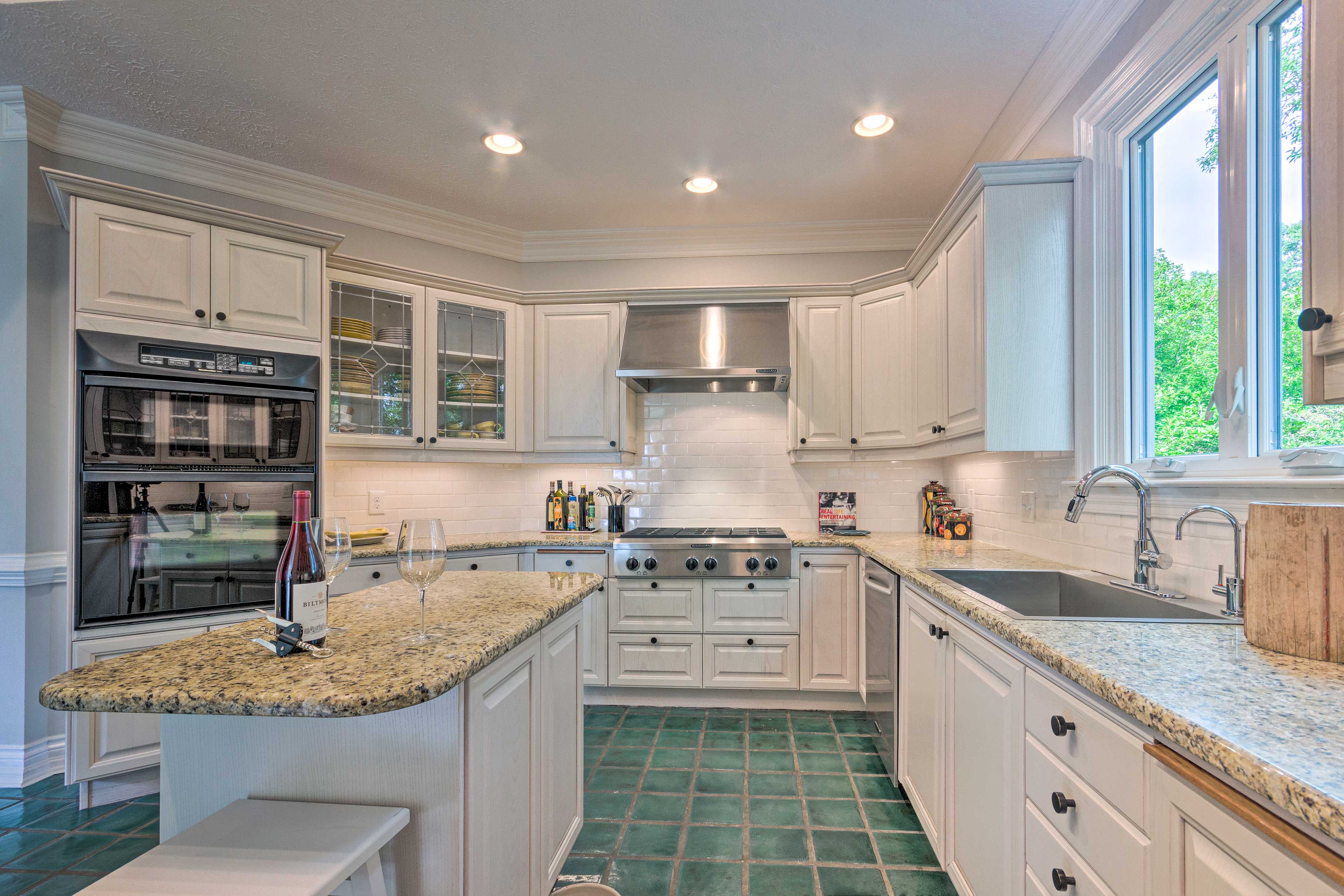 The kitchen comes fully equipped with stainless steel appliances.