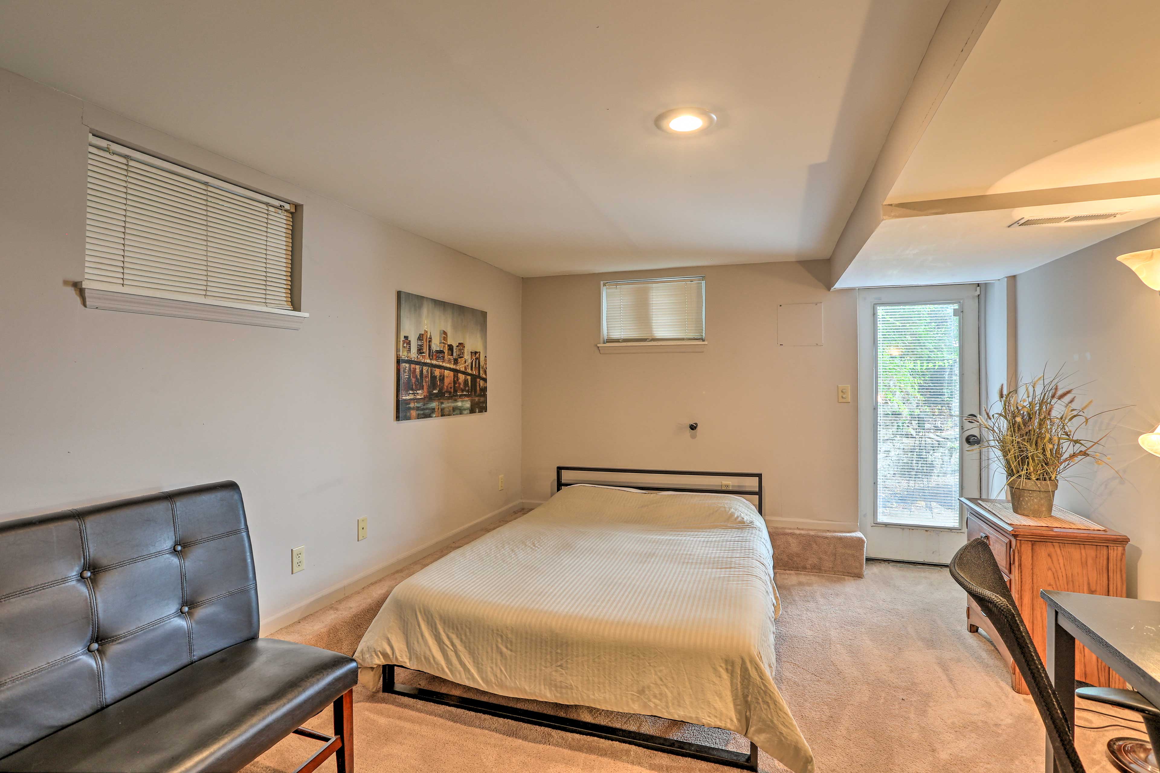 The bedroom offers a private space complete with a queen bed.