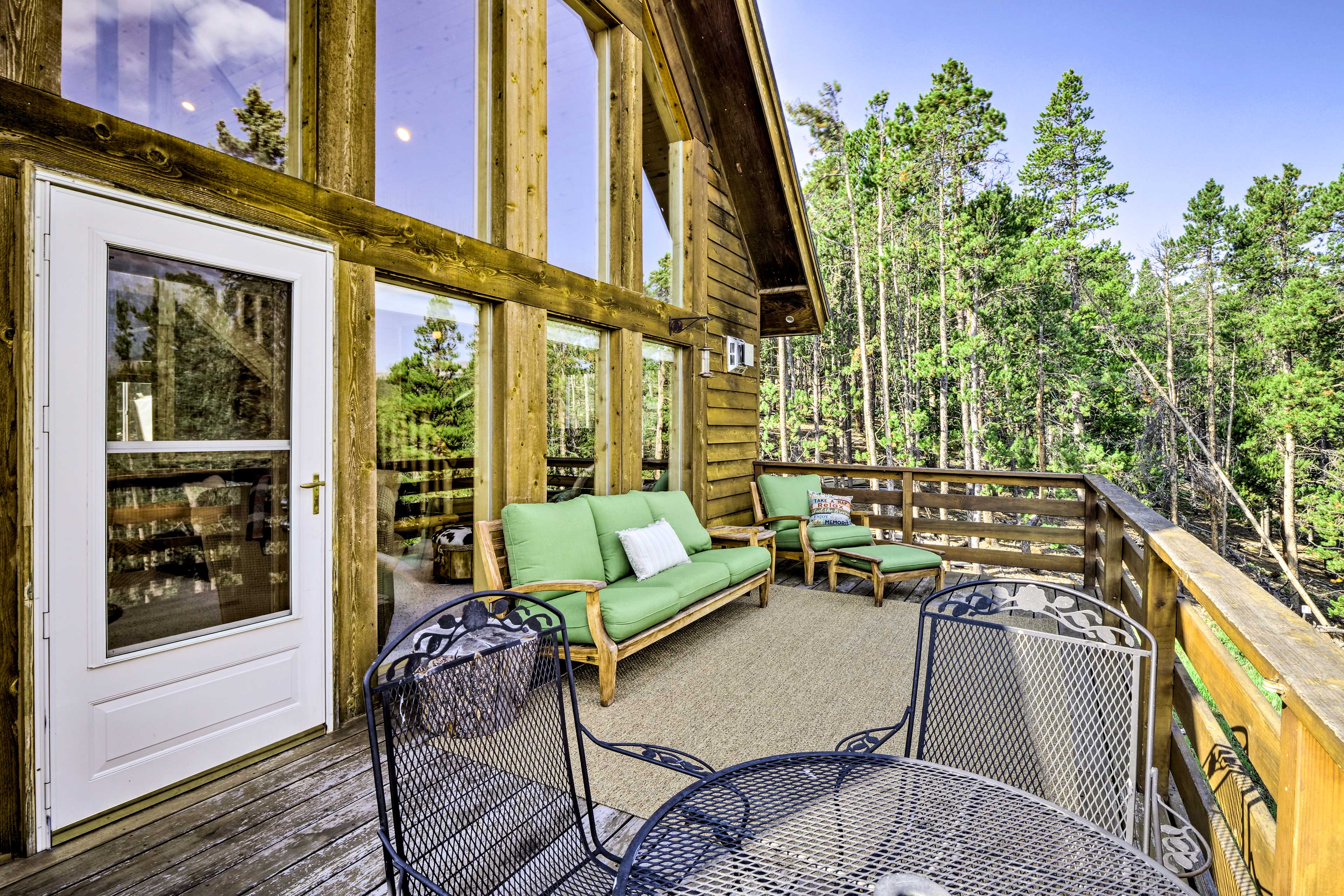 The deck is furnished to provide a comfortable outdoor space.