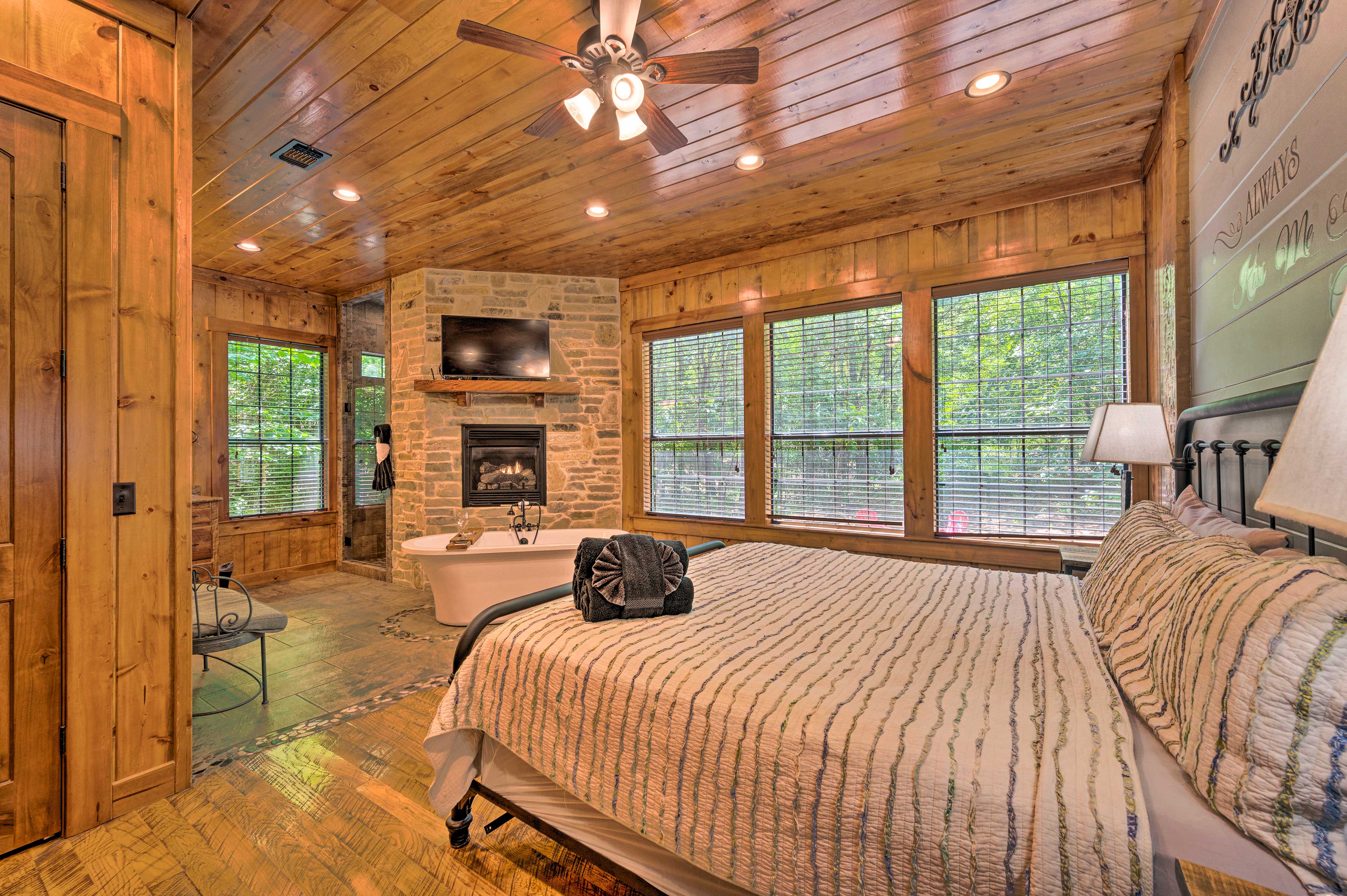 The first master bedroom features a king-sized bed.