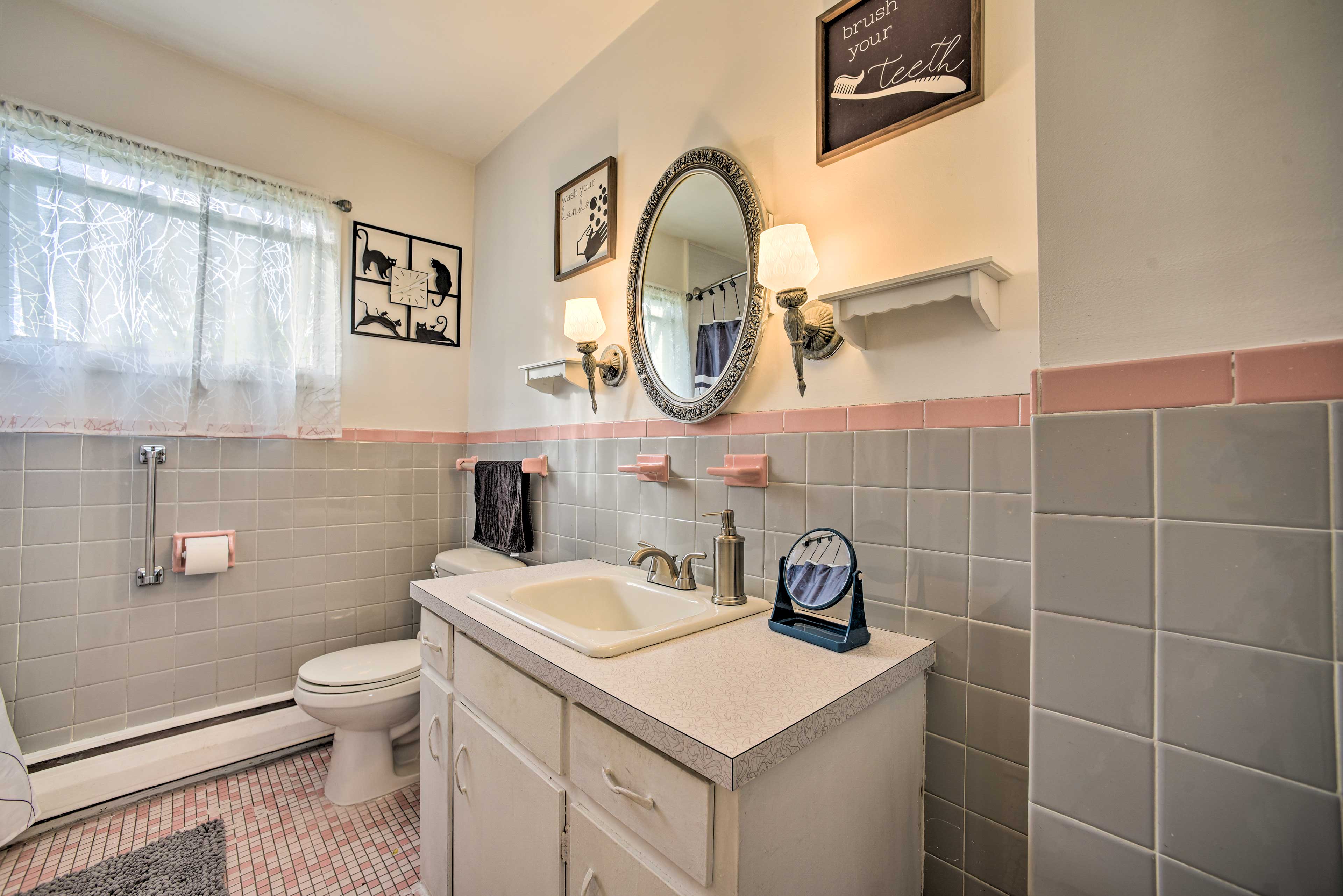 This bathroom offers a shower/tub combo for your convenience.