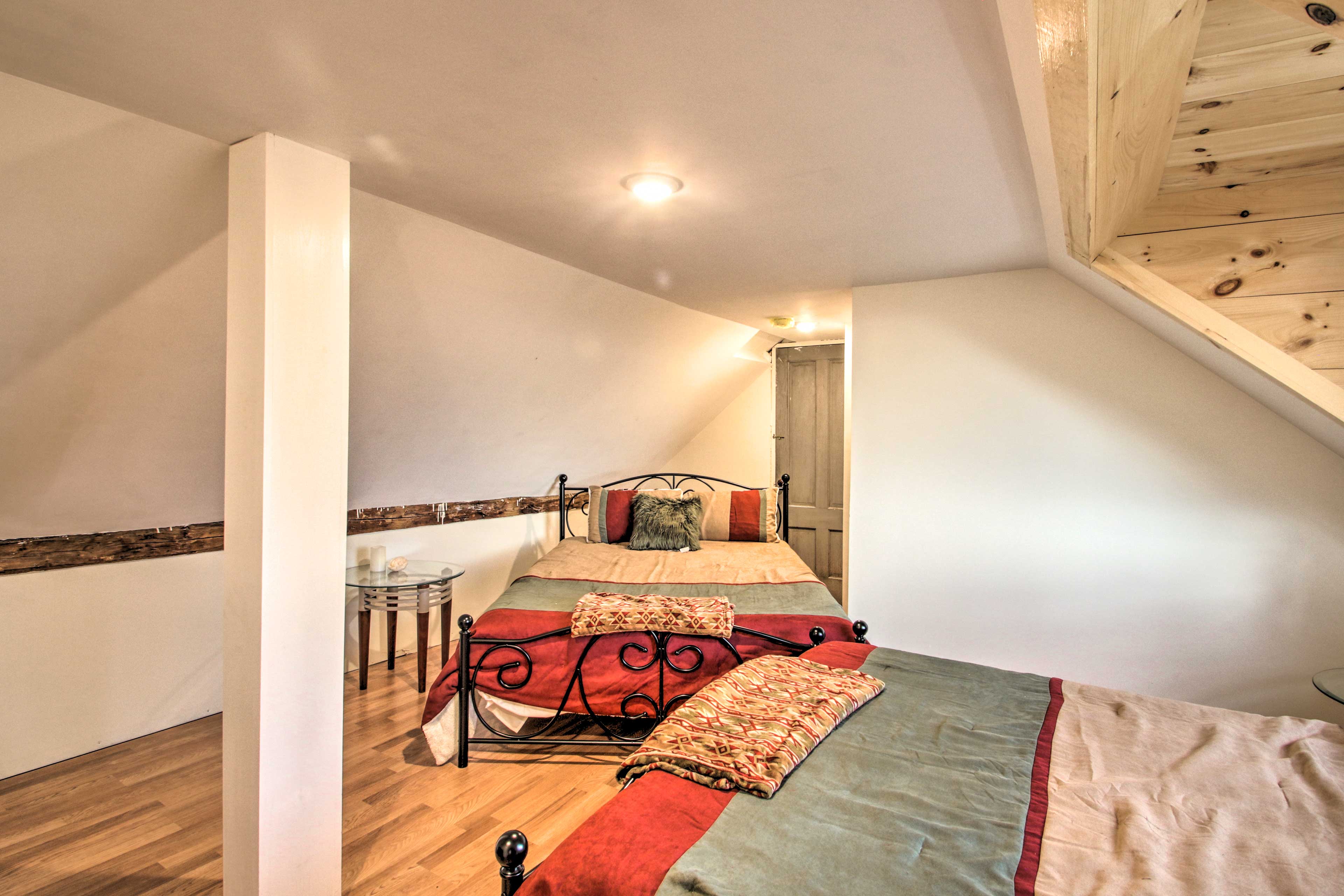 The second bedroom features 2 additional queen-sized beds.