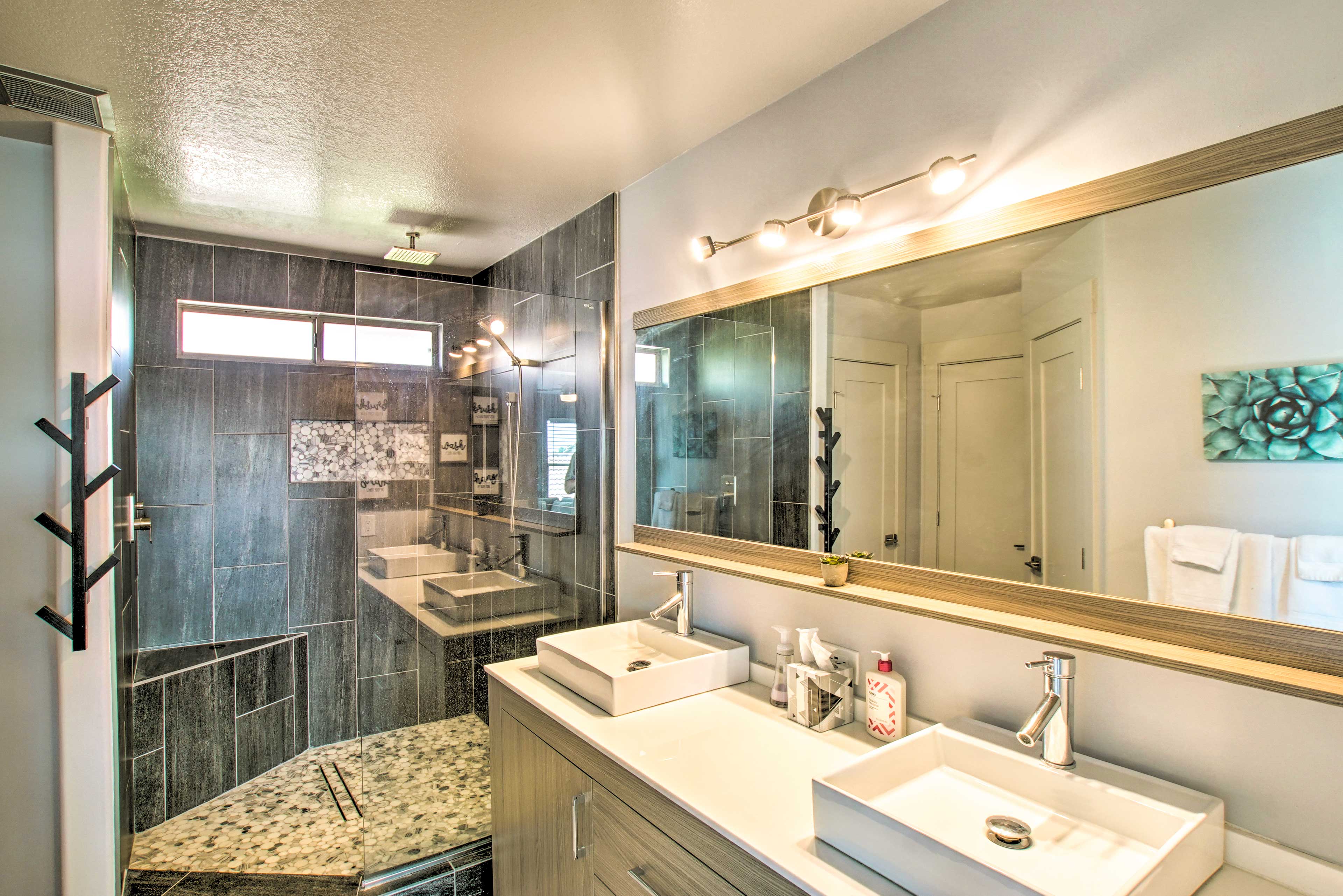 The en-suite offers a walk-in shower and dual sinks, perfect for getting ready.