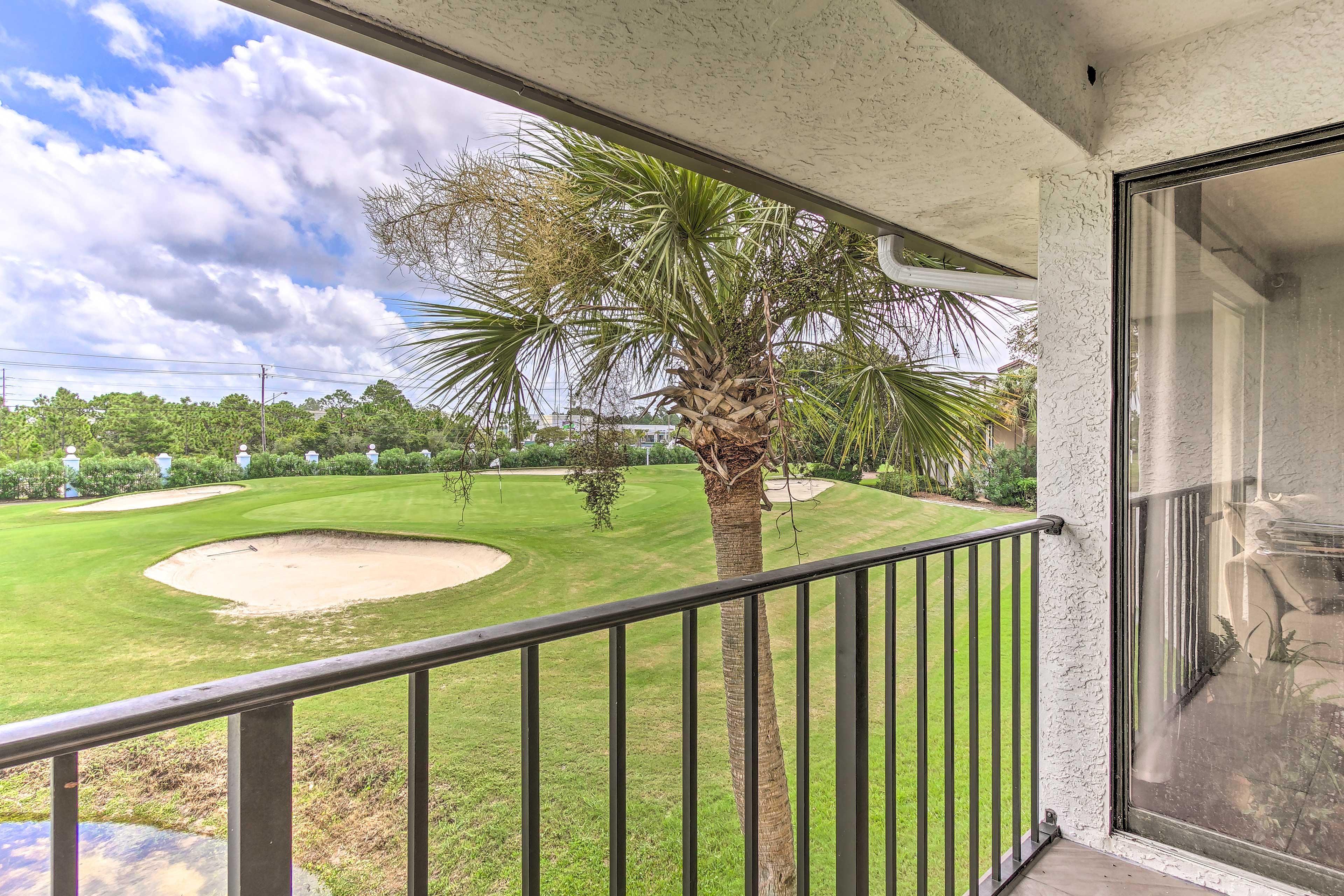 Soak in the golf course views from the condo's balcony.