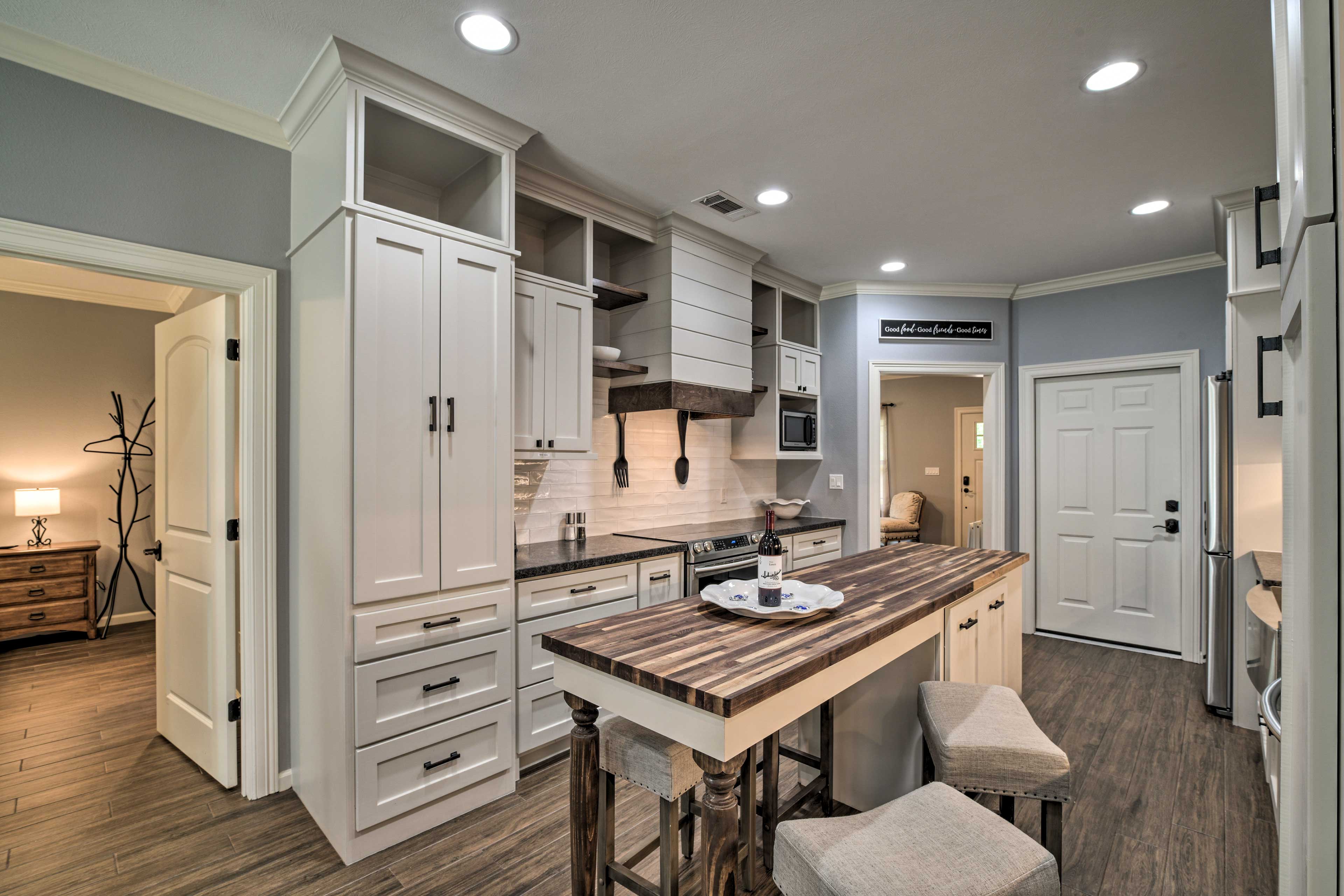 This kitchen is fully equipped with stainless steel appliances.