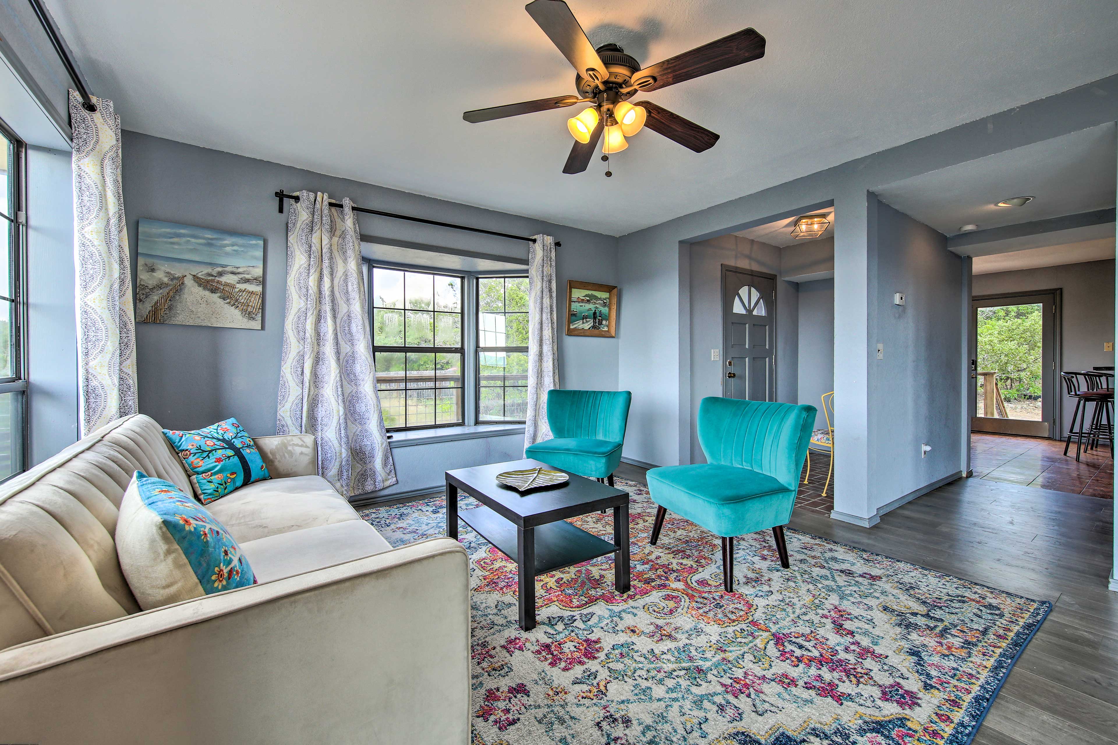 The living room boasts multiple sitting areas so your group can spread out.