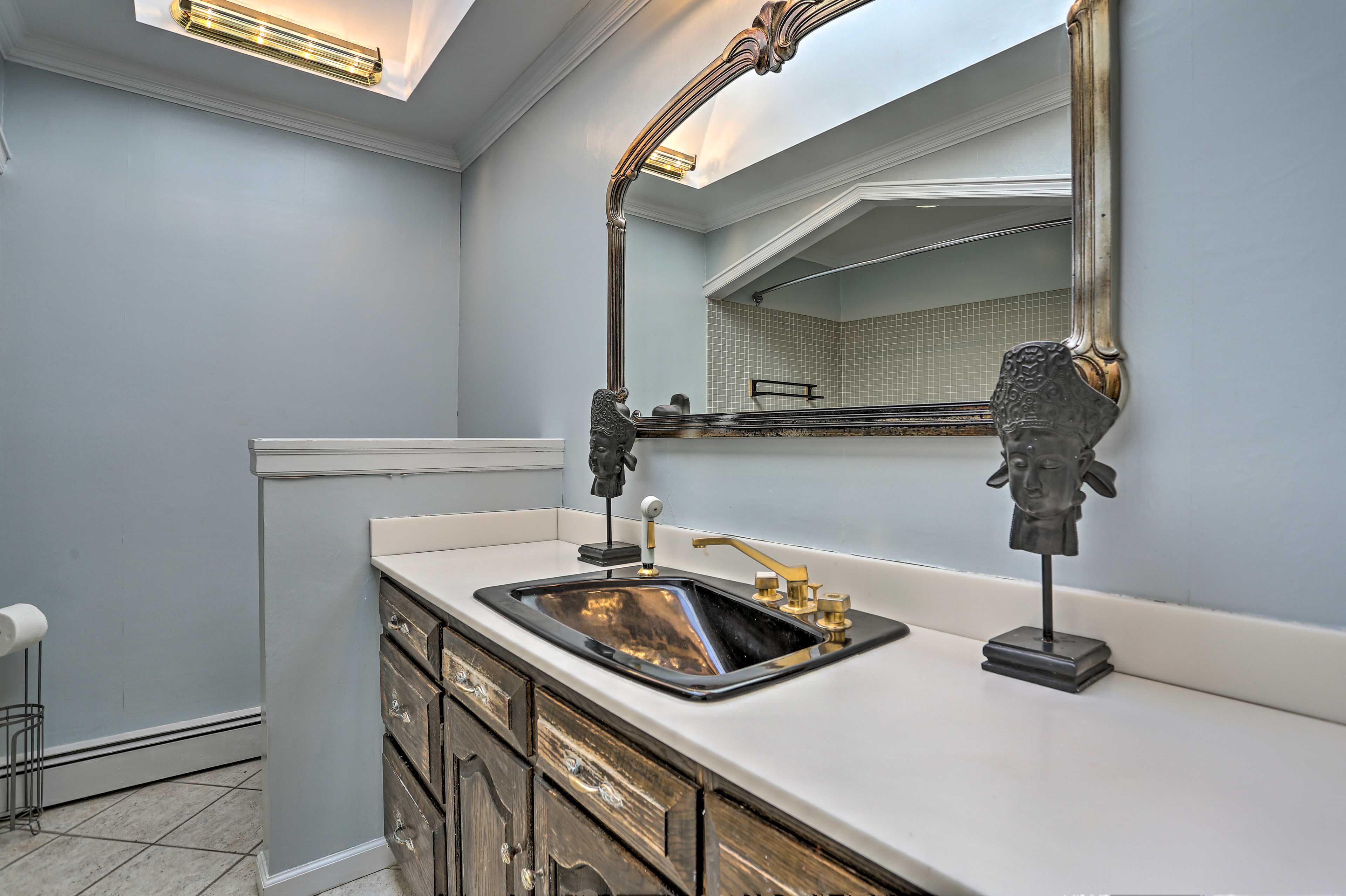 A second full bathroom features a soaking tub.