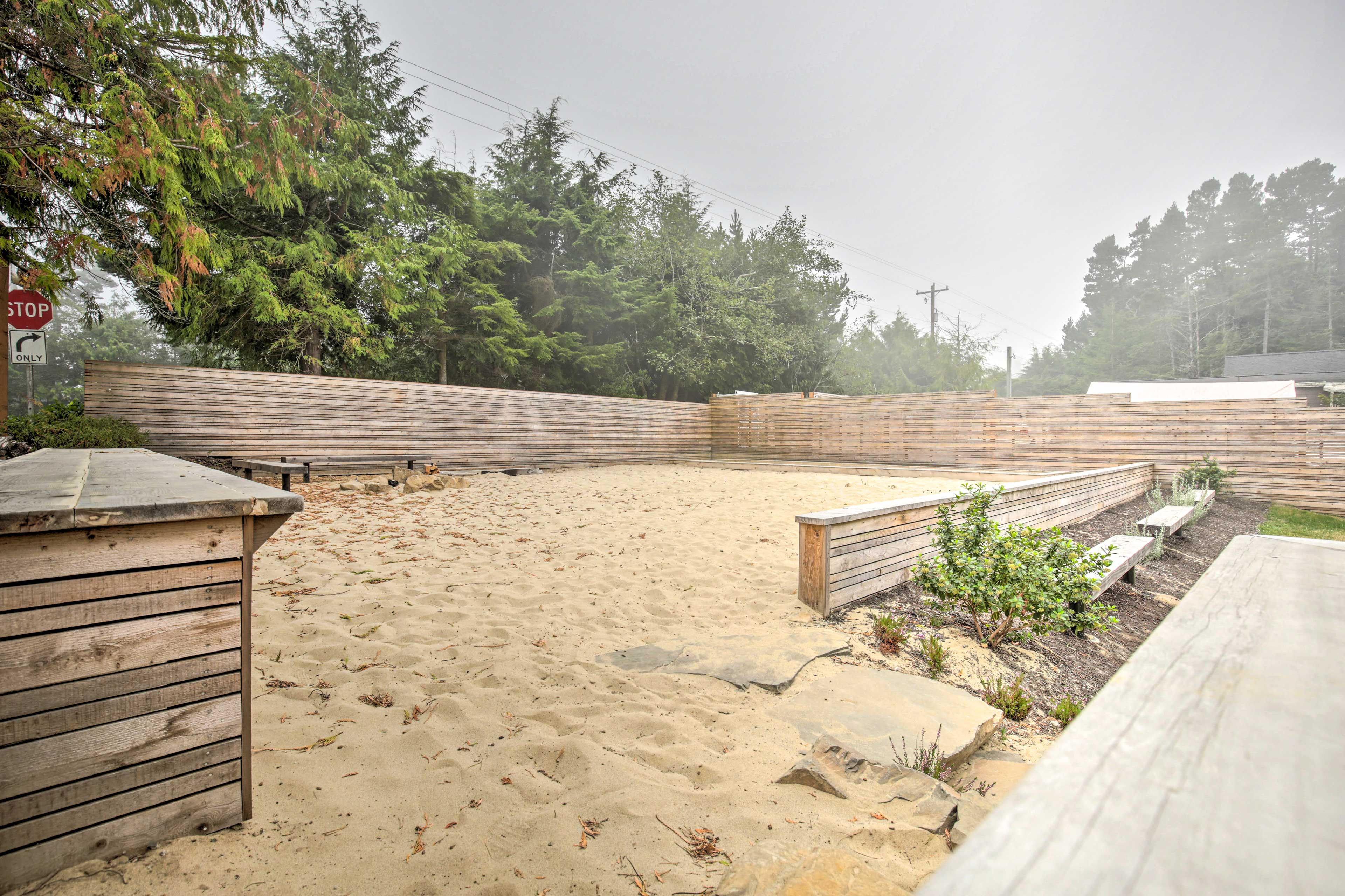 The house features access to a sandy play area!