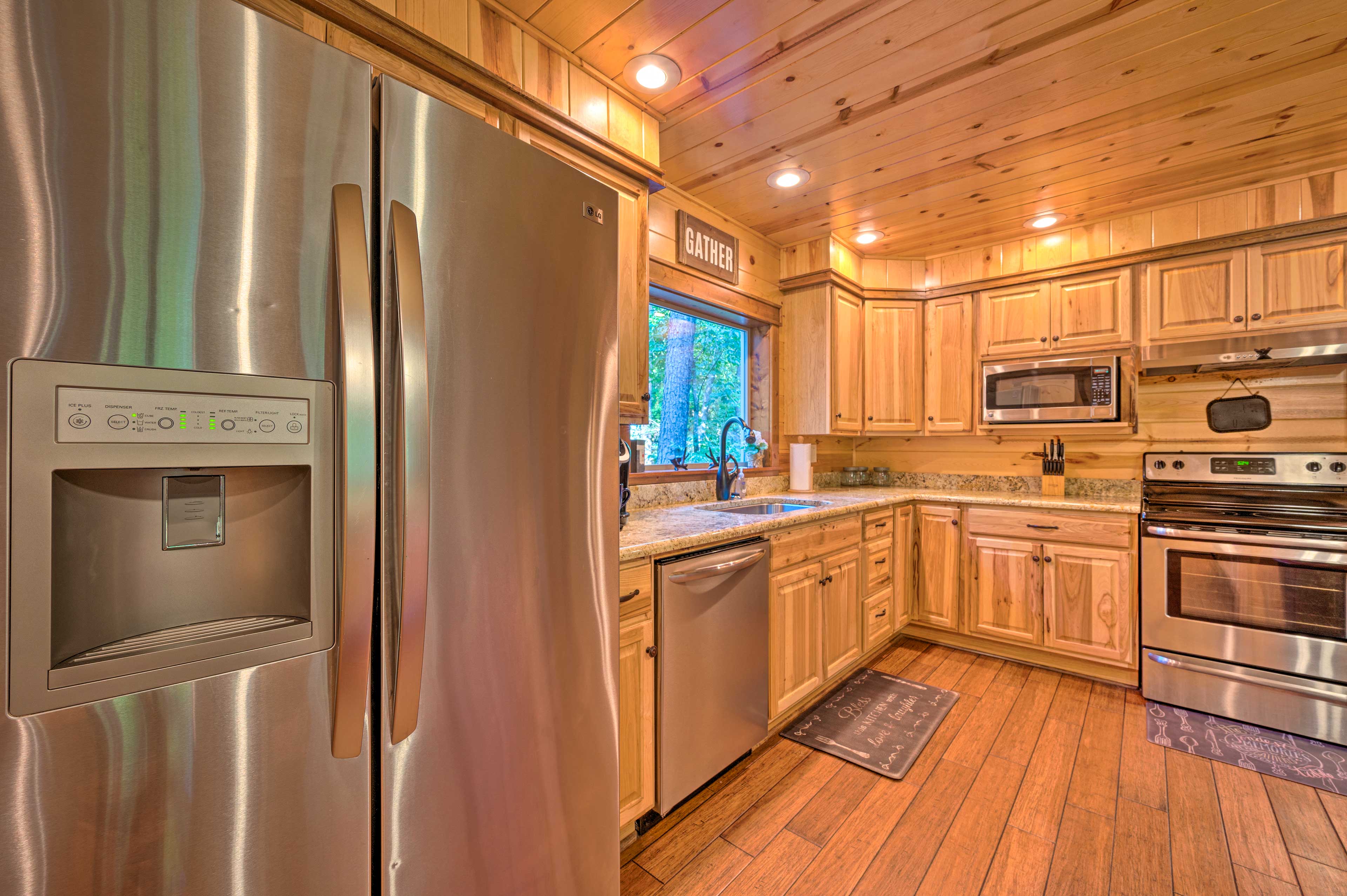 The stainless steel fridge is equipped with an icemaker.