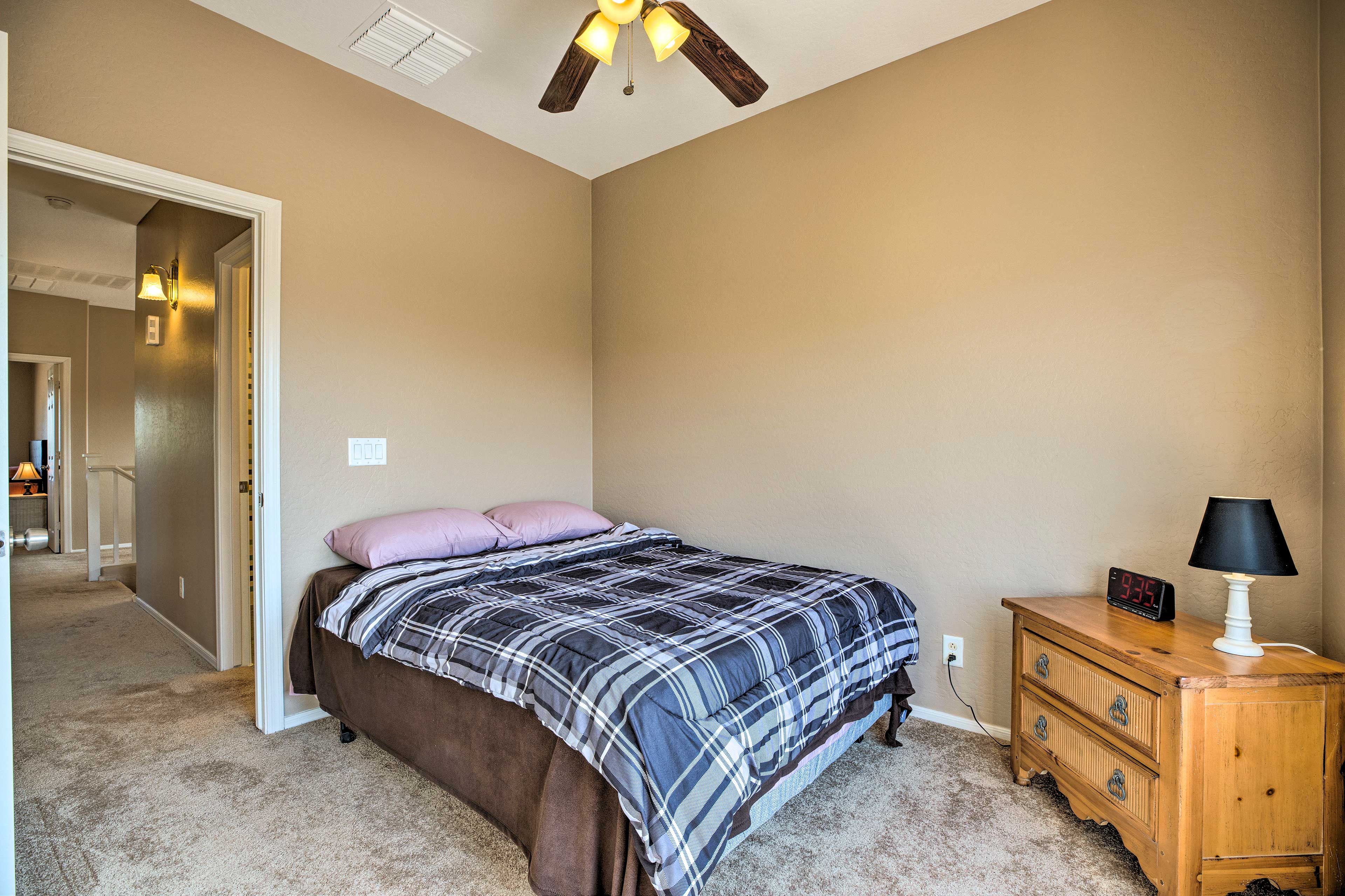 The ceiling fan will keep a breeze flowing while you sleep.