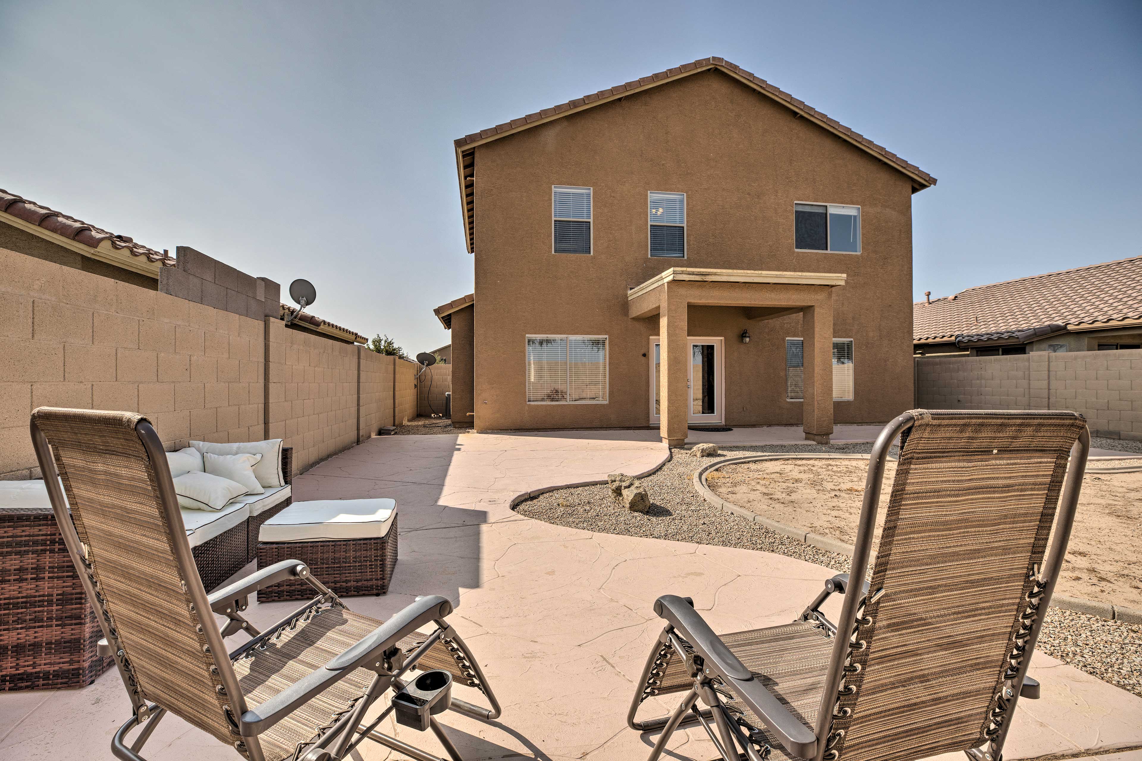 Step outside to lounge in the backyard.