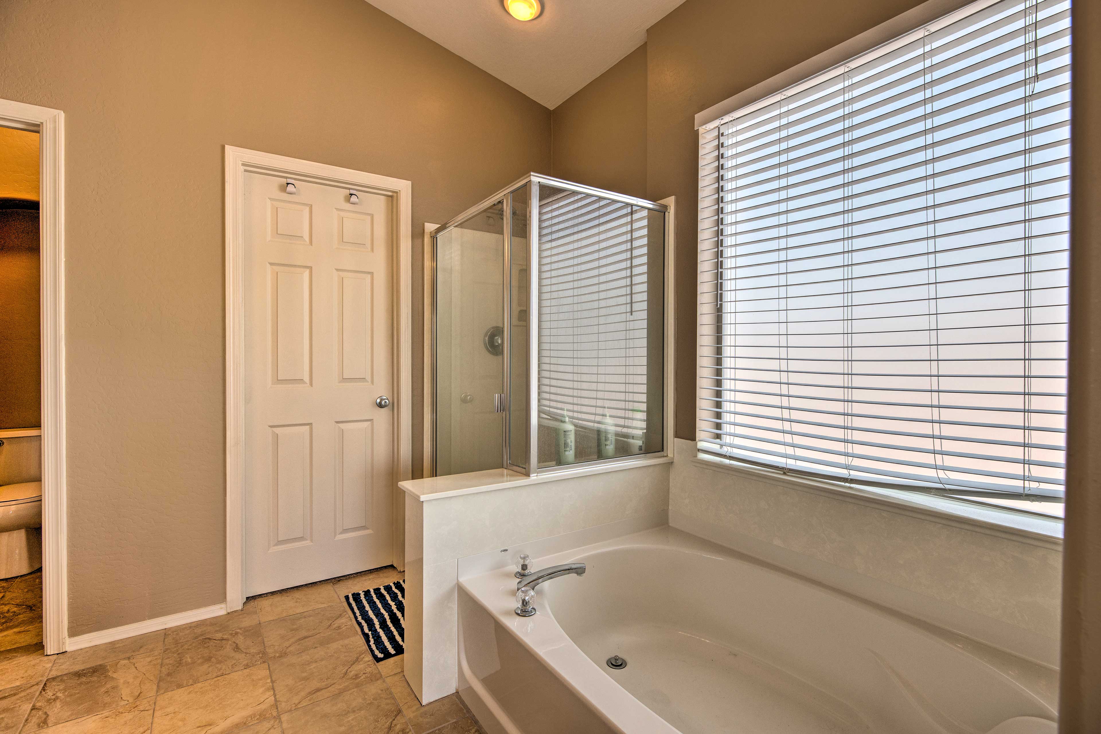 Rinse off in the walk-in shower or soak in the tub.