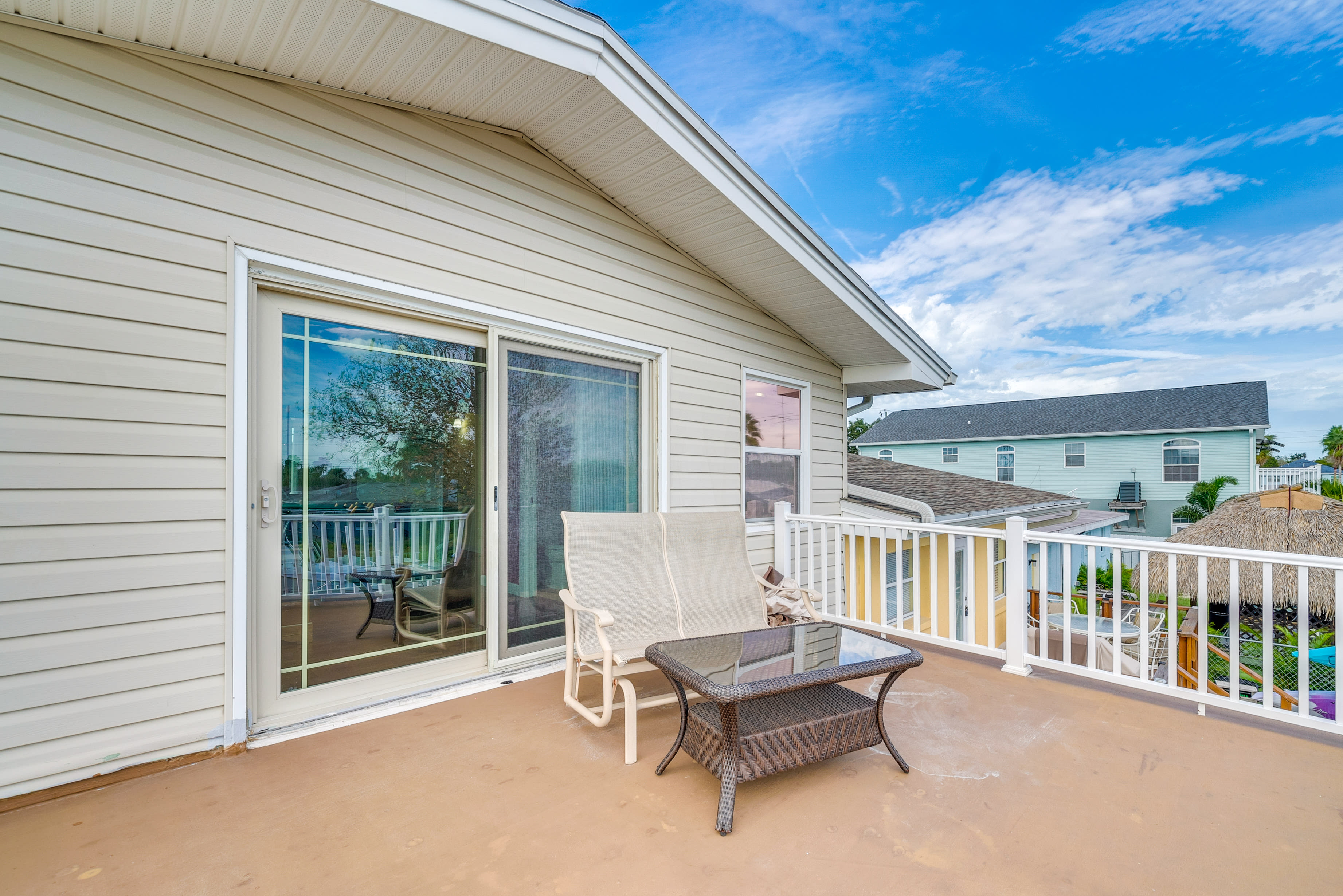 2nd-Floor Deck | Access via Bedroom 1 | Seating | Canal Views