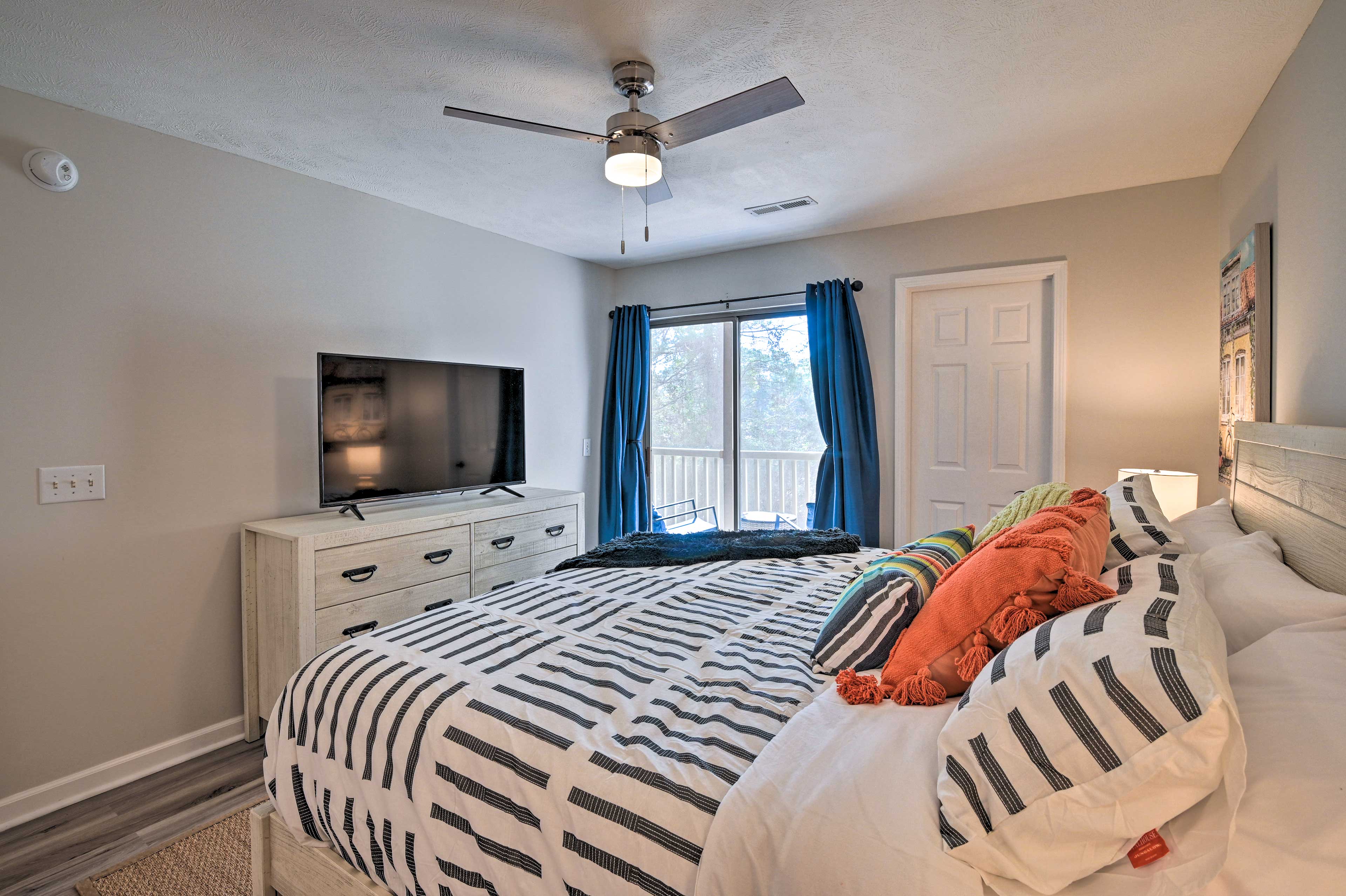 Bedroom 1 | Smart TV w/ Cable | Linens Provided | Access to Screened-In Balcony