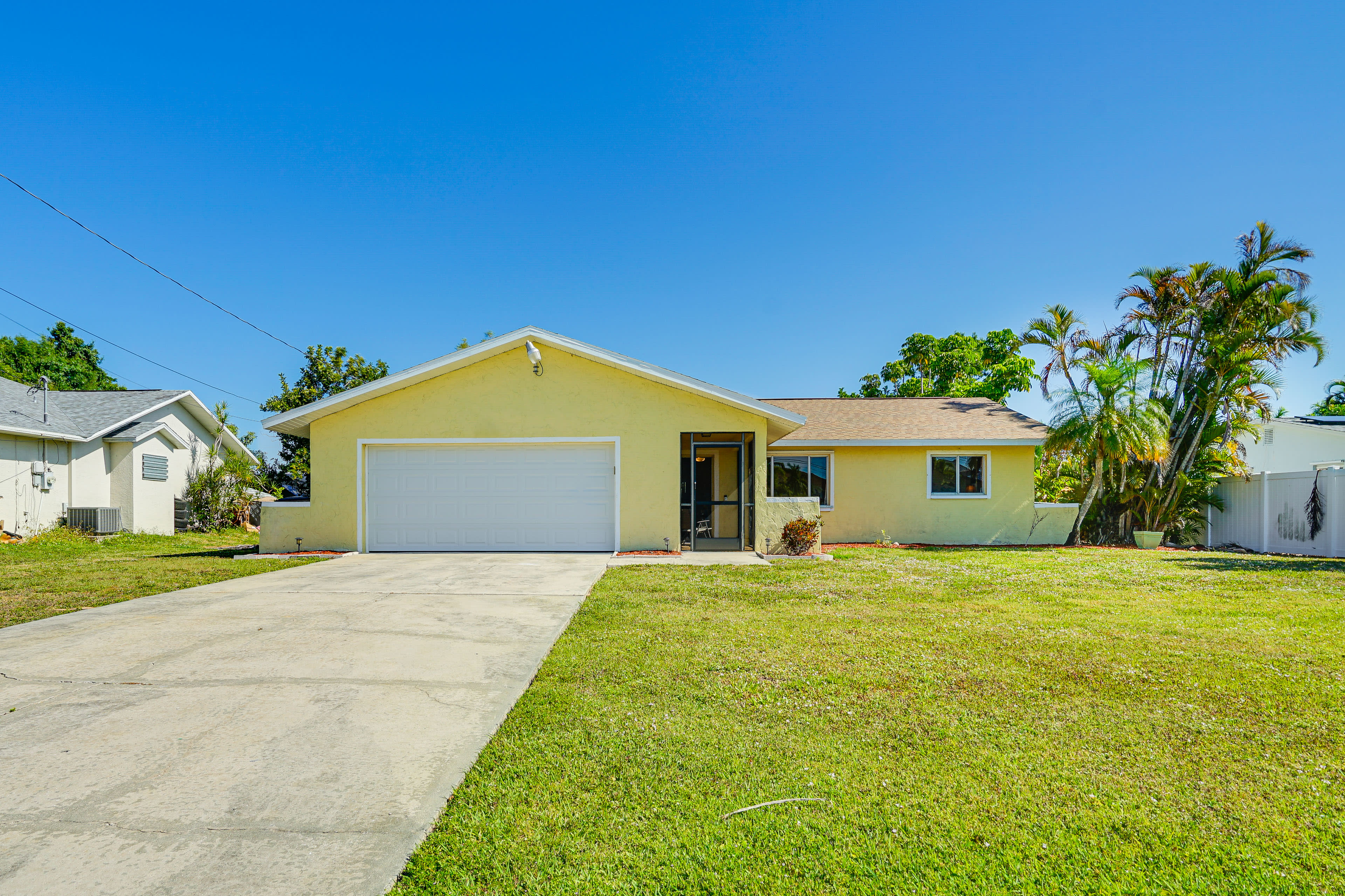 Property Exterior | Fenced-In Back Yard | Private Pool