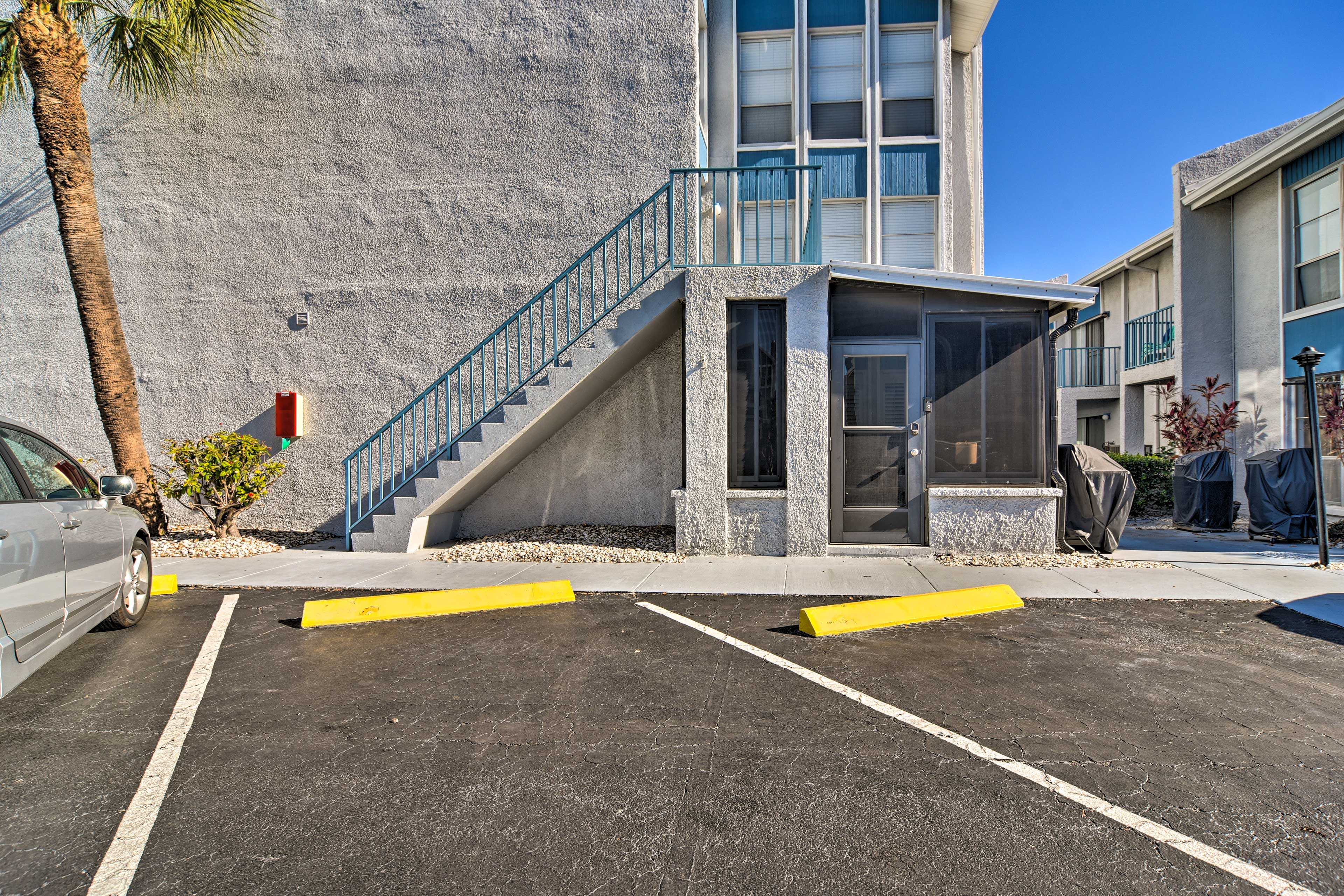 Parking | Community Lot (2 Vehicles) | Stairs Leading to Unit