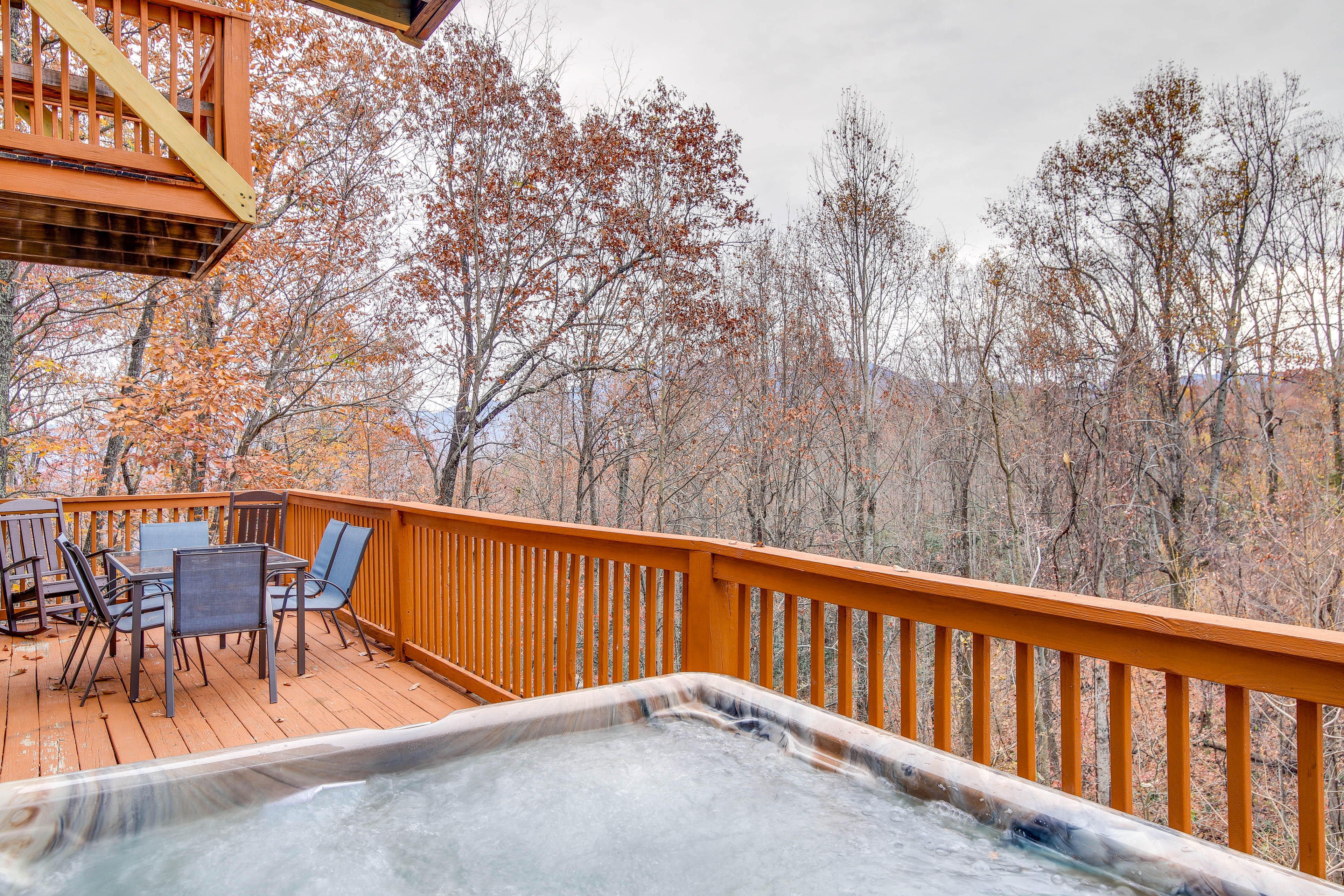 Cabin Exterior | Furnished Deck | Private Hot Tub