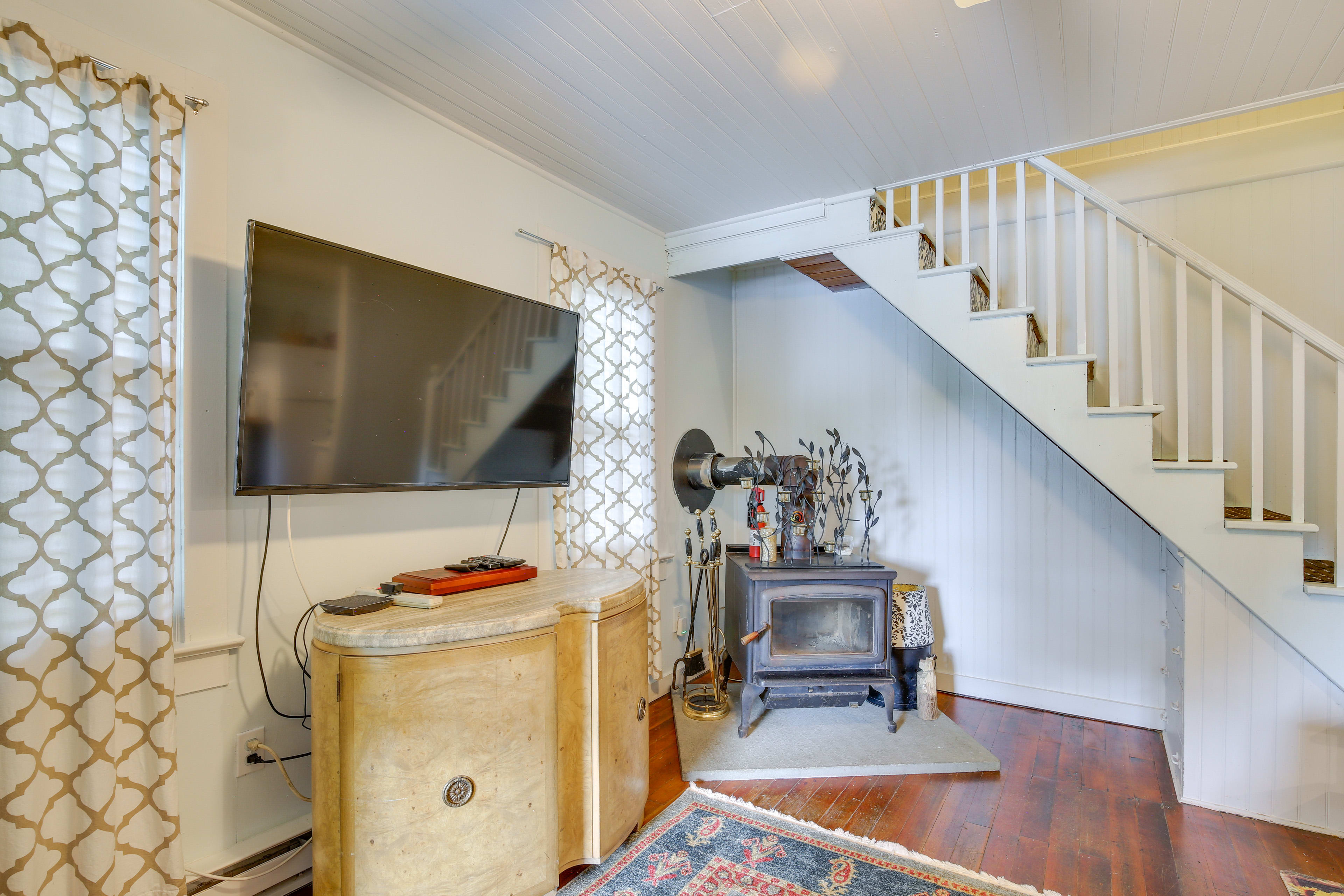 Living Room | Wood-Burning Stove | Window A/C Unit | Stairs to Access 2nd Floor
