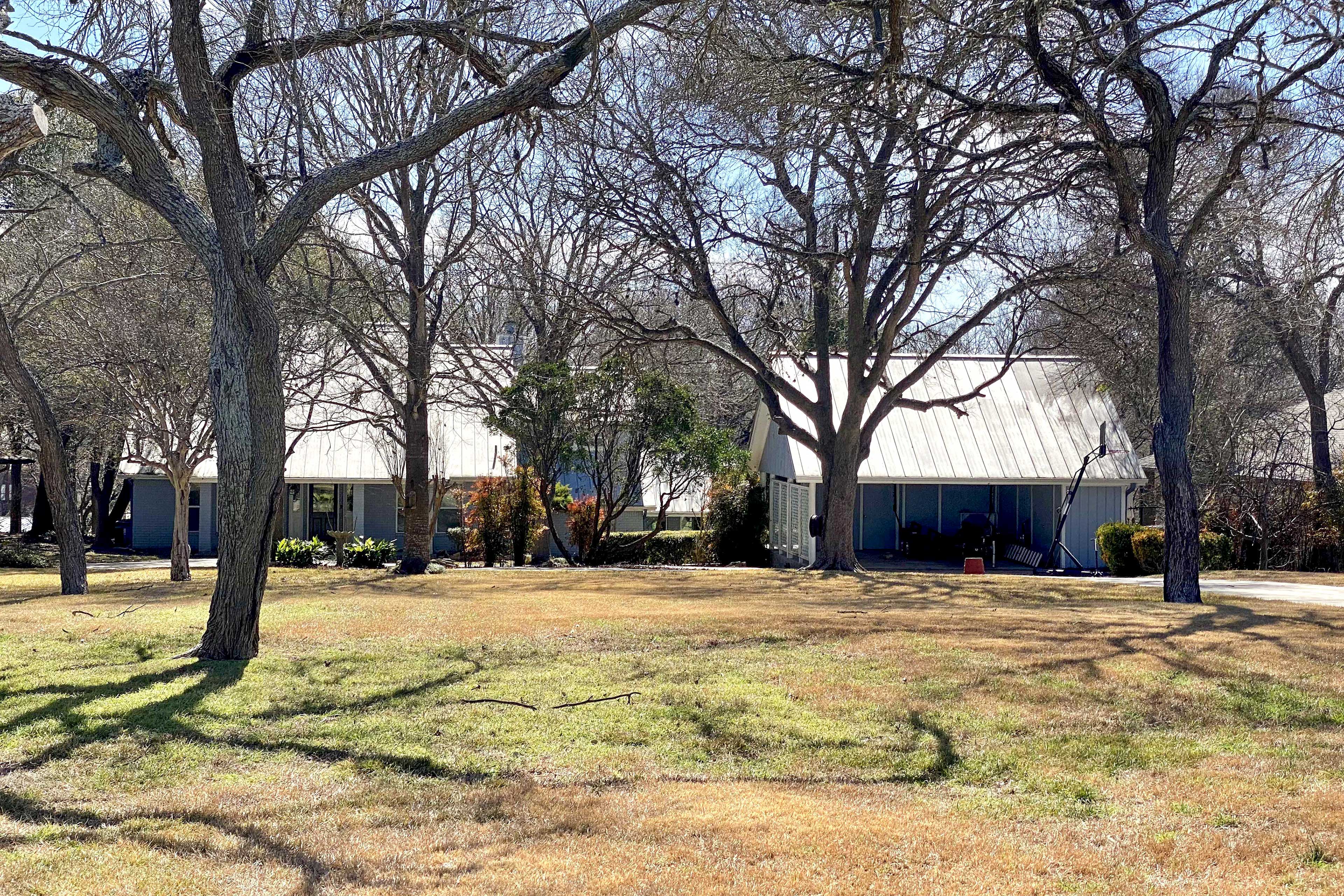 Property Exterior | Carport & Driveway Parking (7 Total Vehicles)