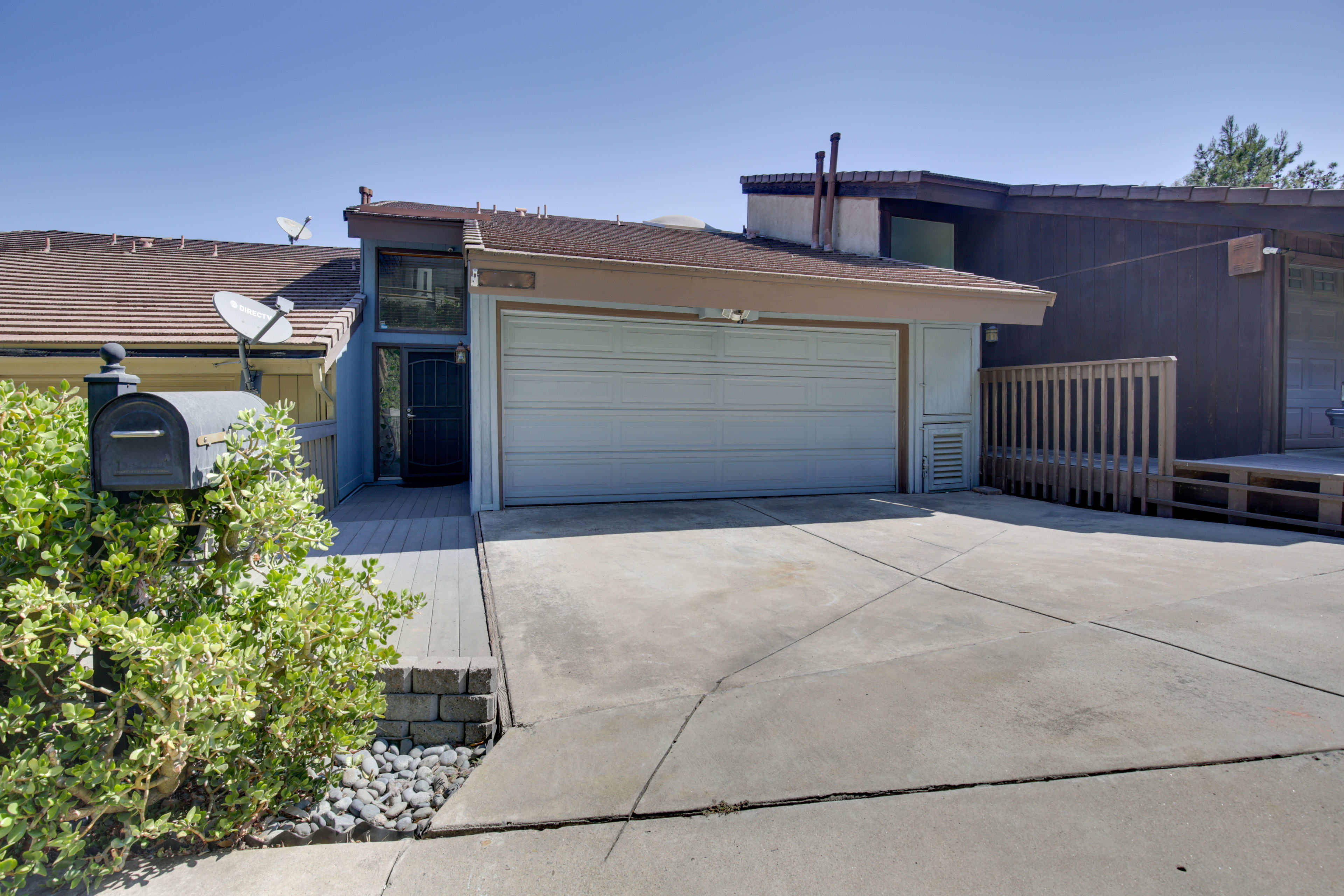 Driveway (2 Vehicles) | Garage w/ EV Charger (2 vehicles)