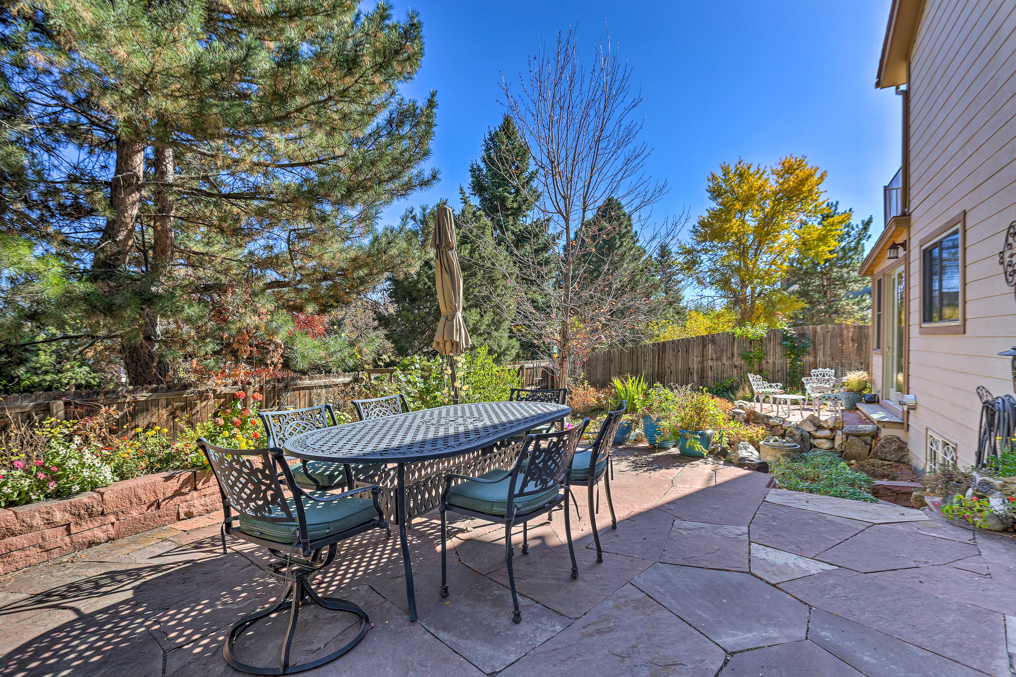 Fenced-In Backyard | Dining Area | Garden | Charcoal Grill