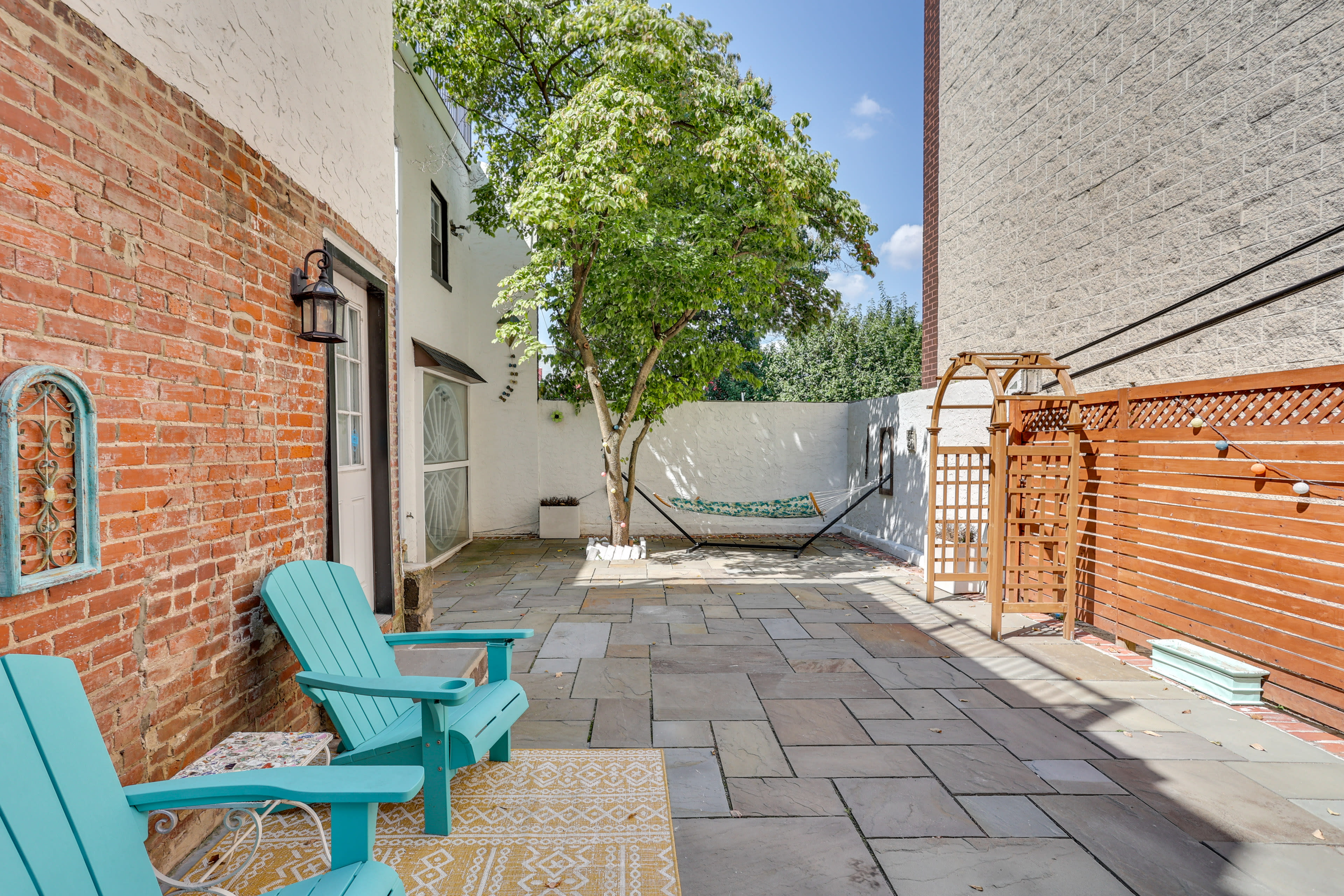 Shared Courtyard | Pergola w/ Seating | Cornhole