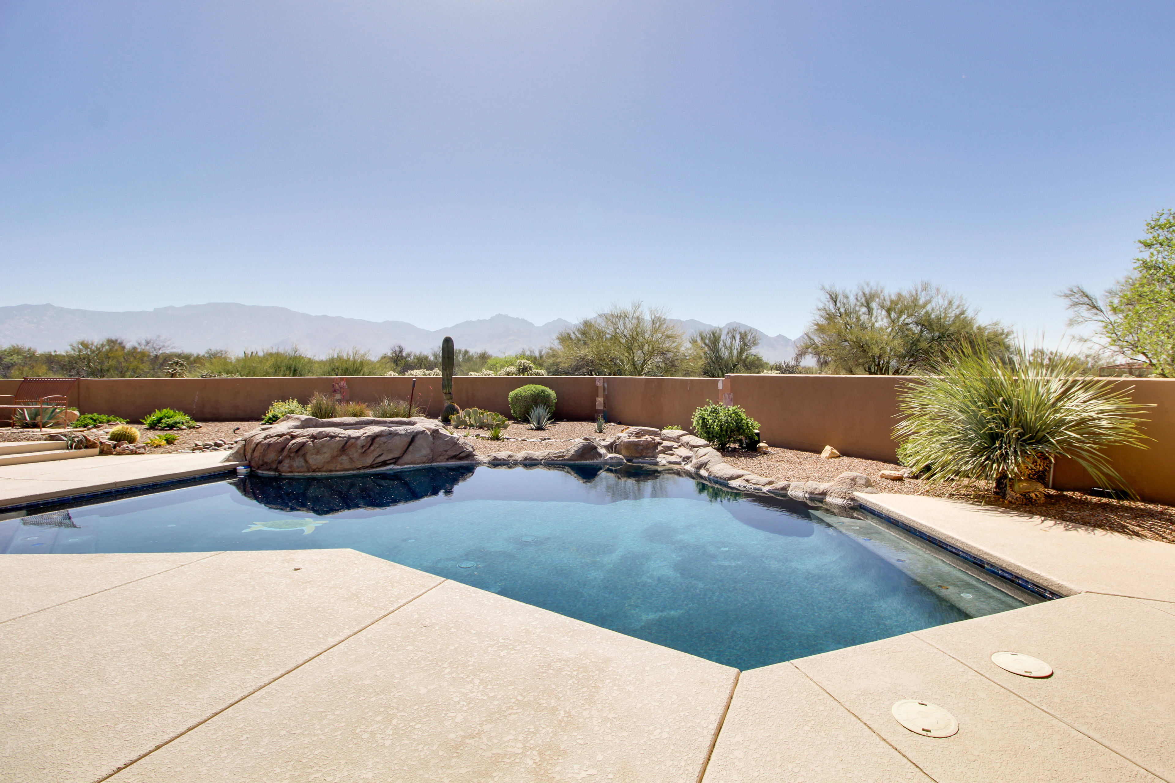 Patio | Outdoor Pool (Depth 2'-8') | Hot Tub | Mountain Views