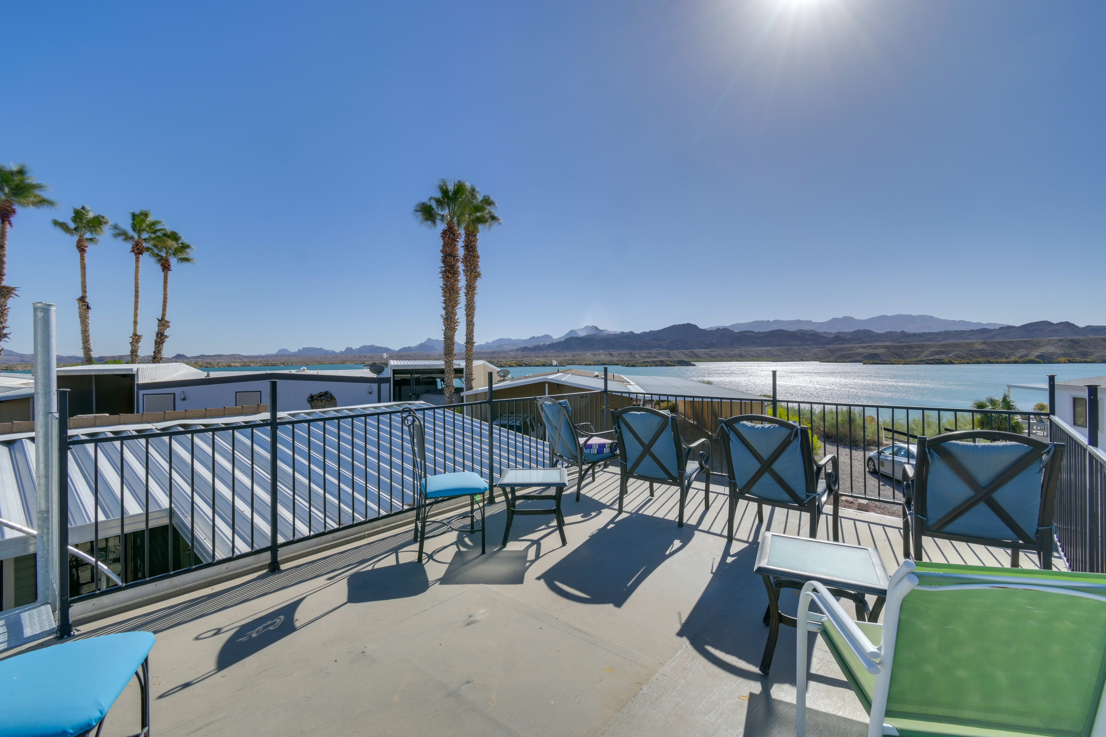 Rooftop Deck | Water/Mountain Views | Outdoor Community Pool | Marina